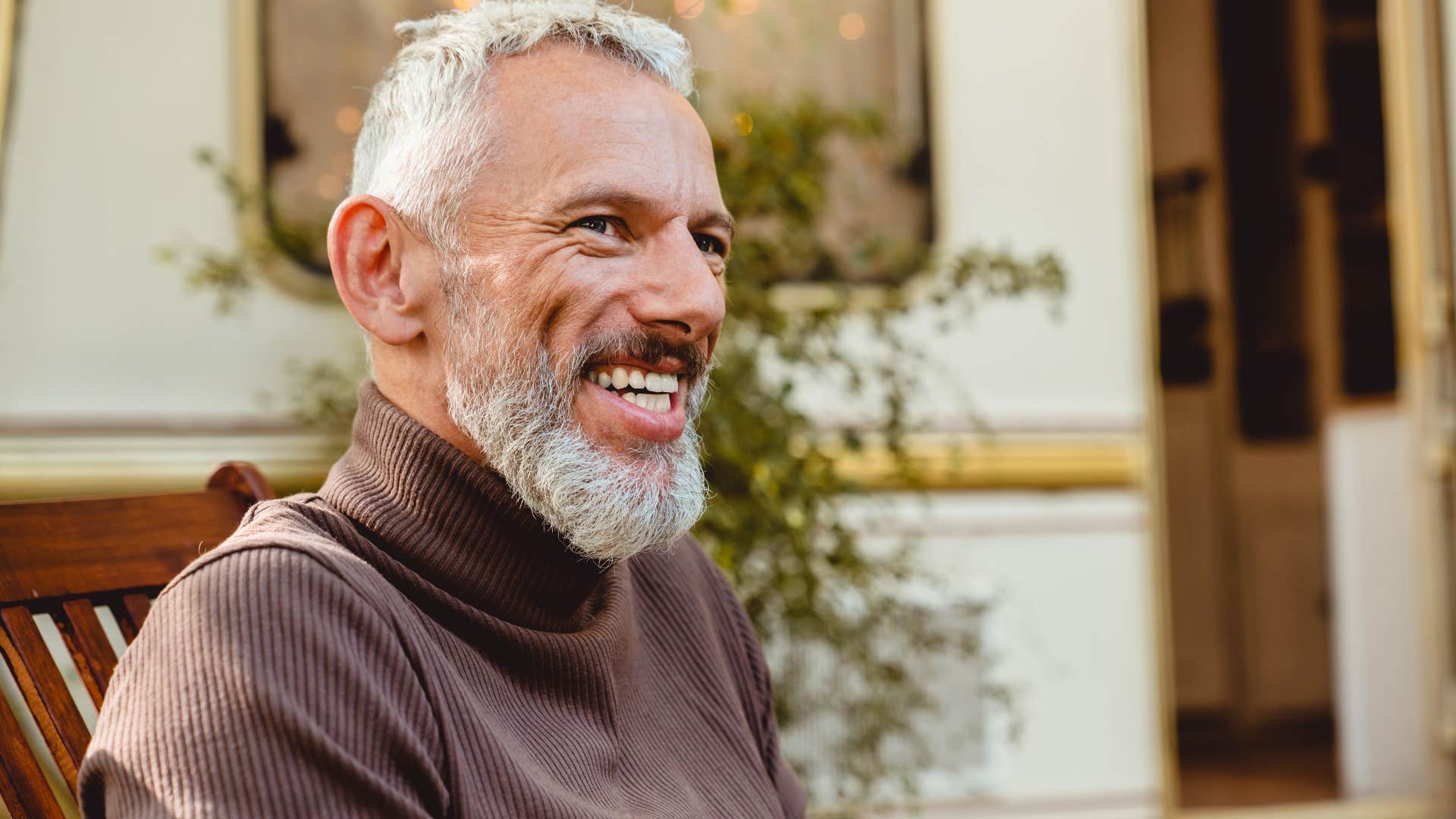 Man who's not afraid to take accountability smiling.