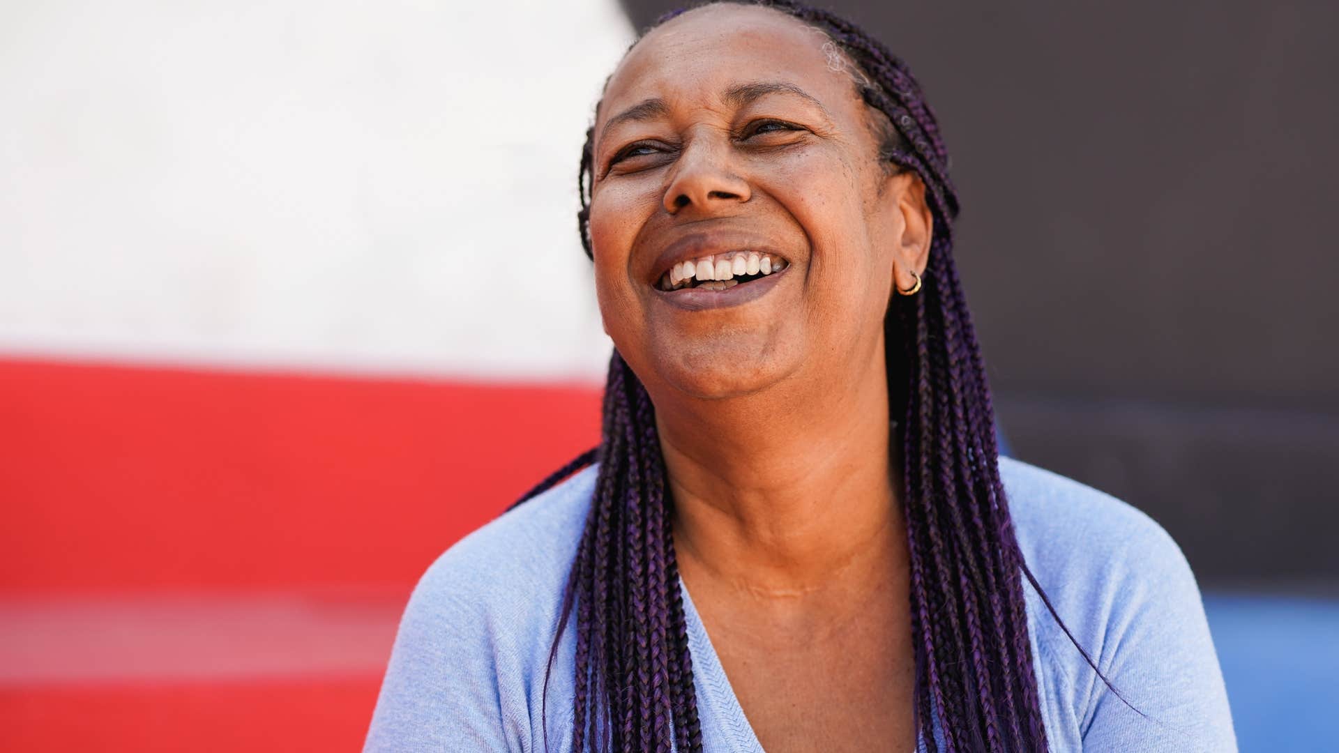 woman who doesn't minimize her presence laughing in public