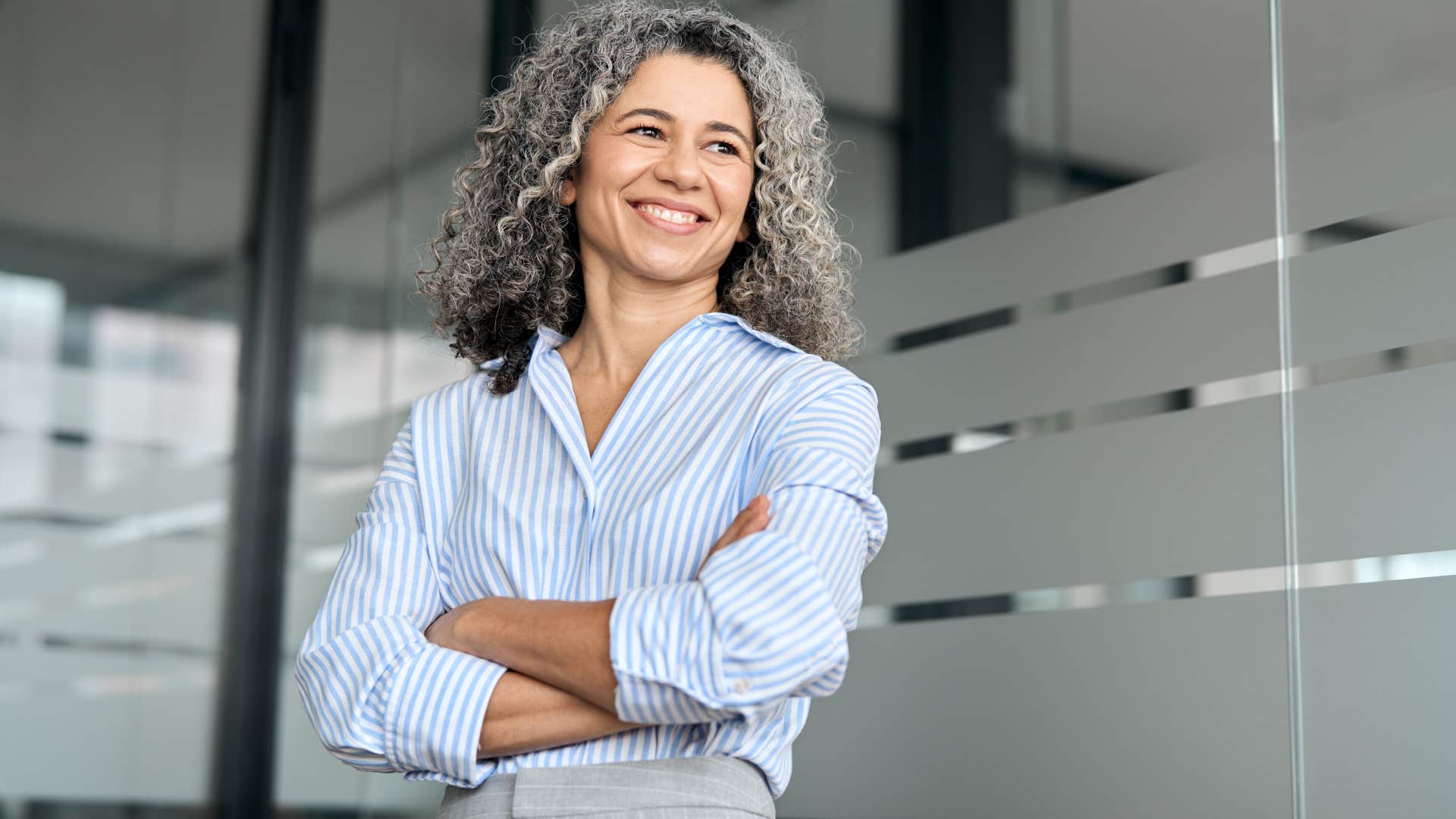 happy older woman who moves intentionally at work