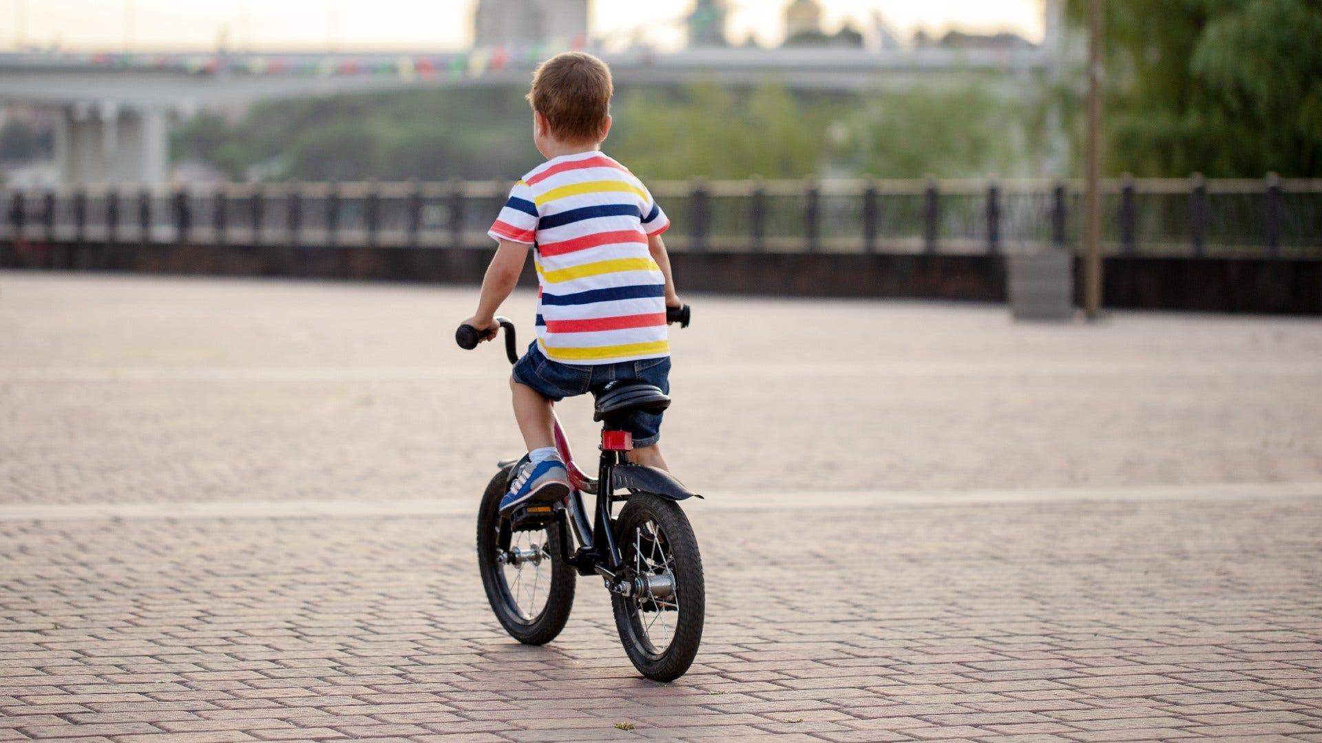 child riding a bike without a helmet that would cause an outrage today