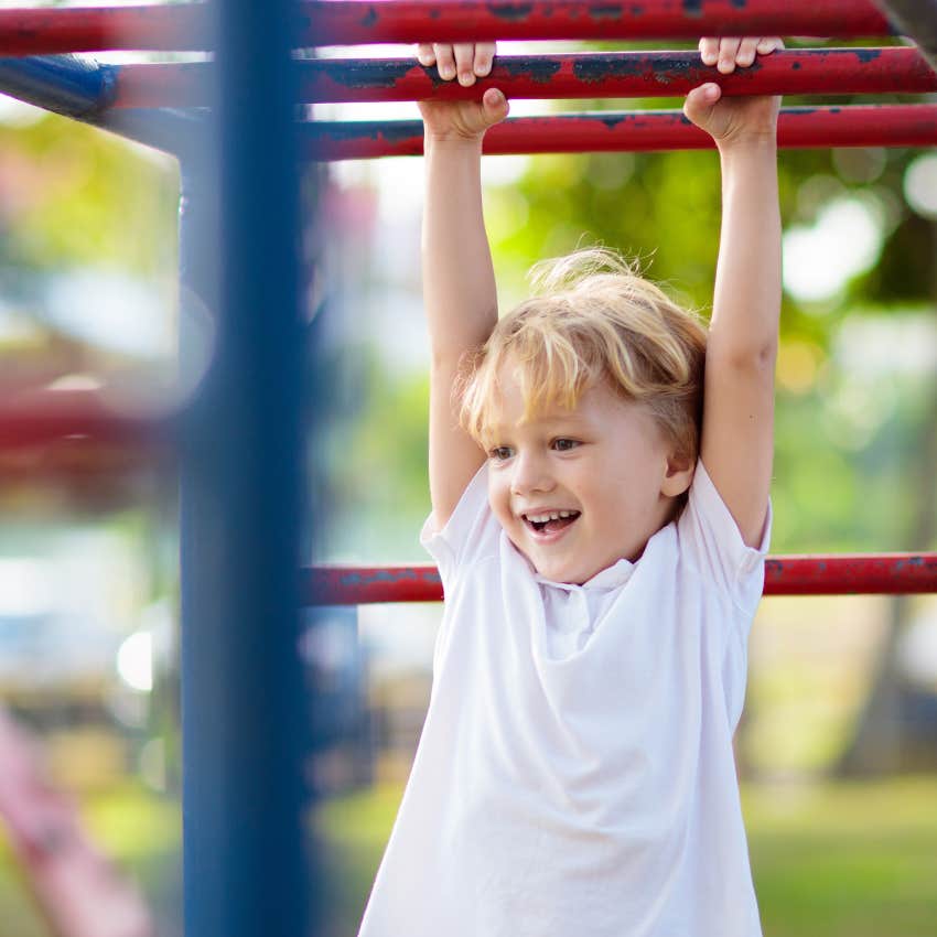 little boy spending time outside on a playground