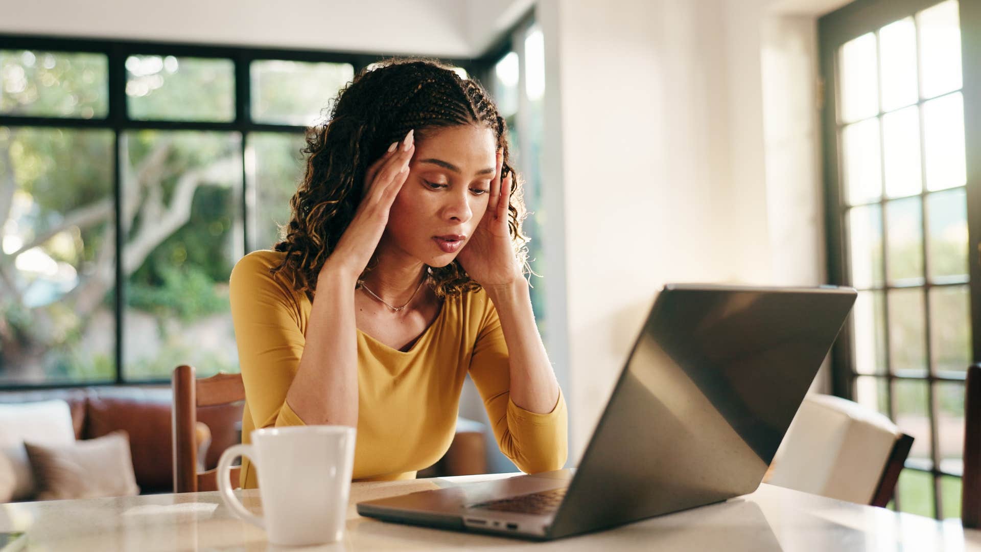 highly sensitive woman feeling annoyed at work after being around strong personalities