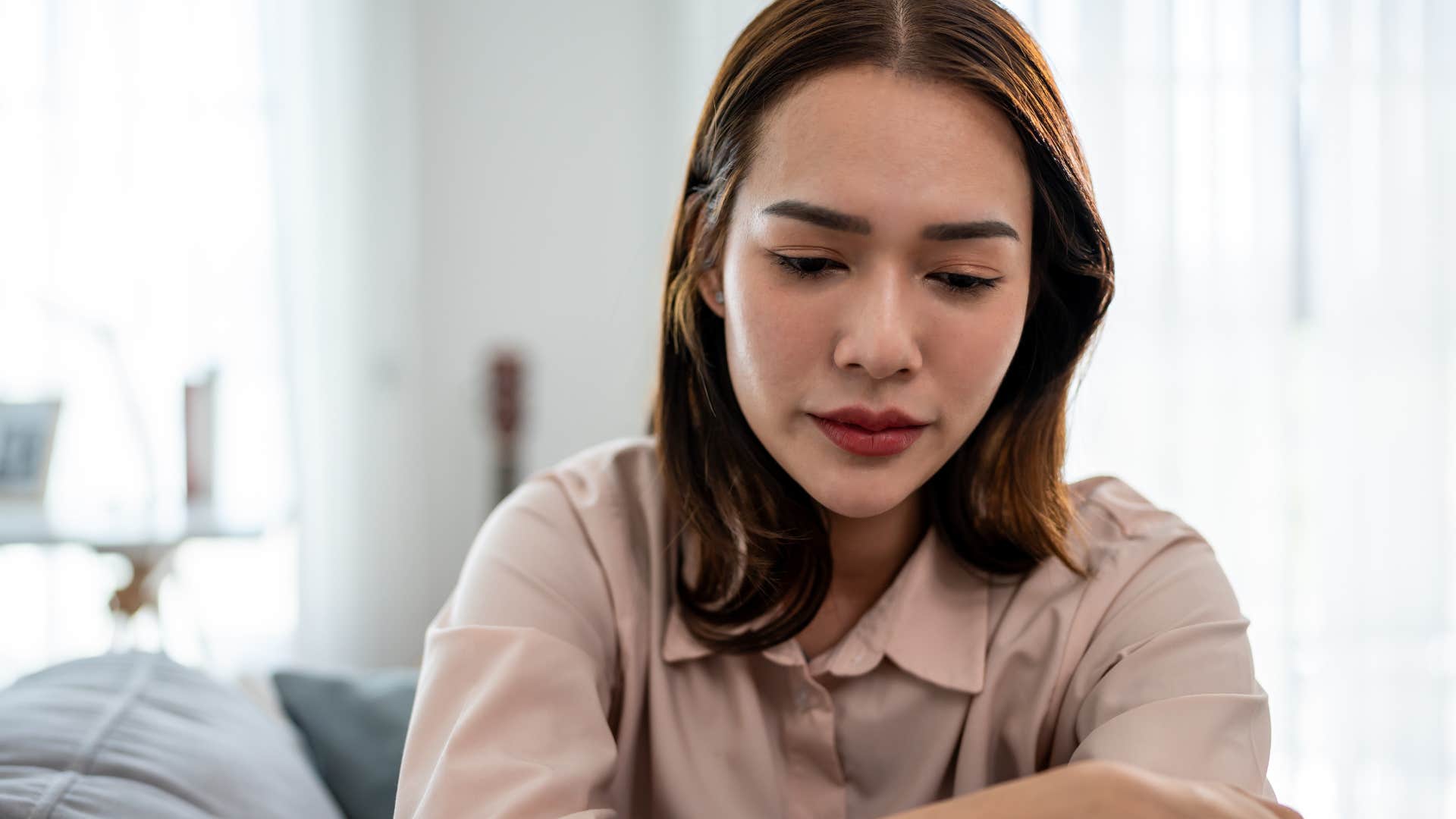 woman feeling upset and drained after being in crowded environments