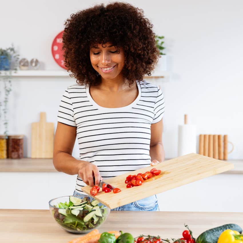 woman chopping vegetables in kitchen things avoid during chinese new year for prosperous fire horse year