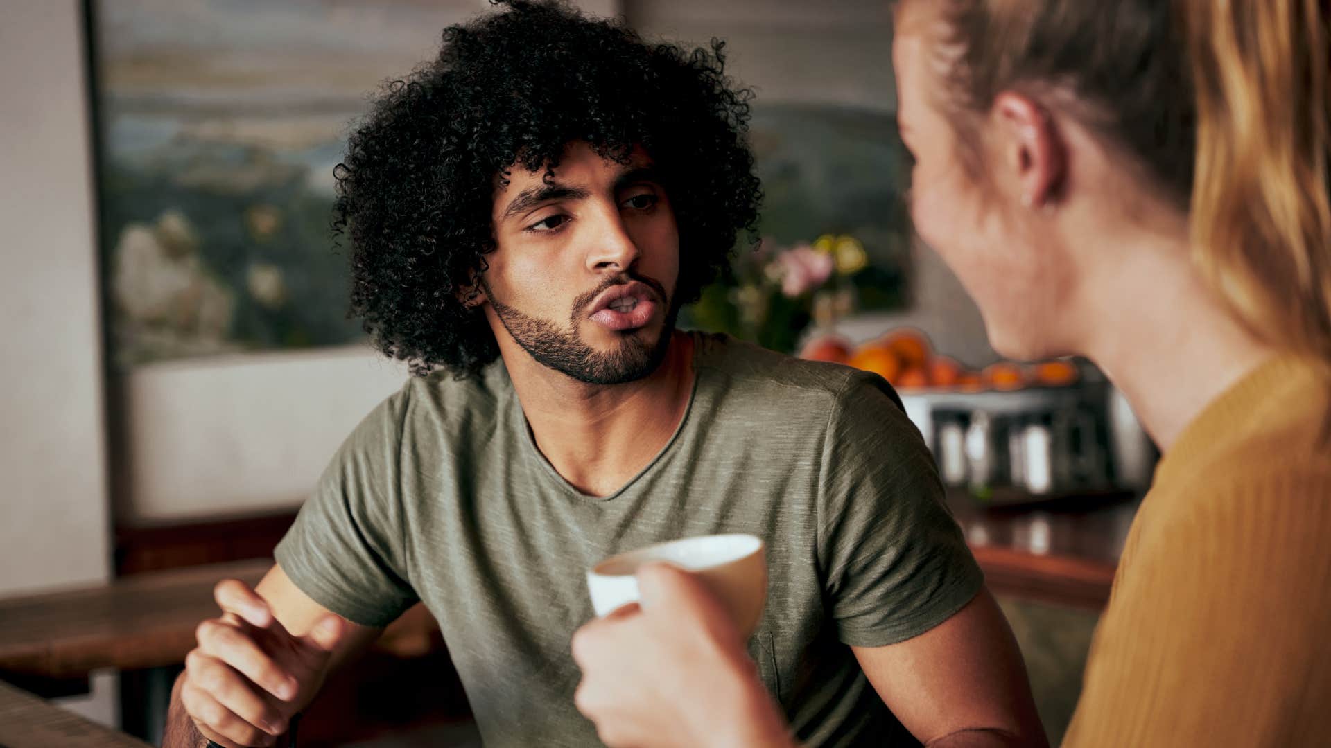 couple having conversation with gentlemanly husband saying lets come back to this