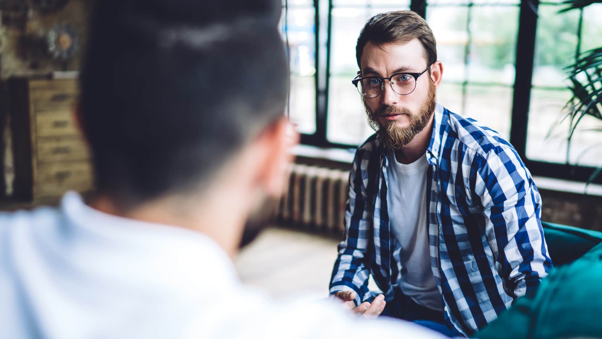 rude cold-hearted man telling friend that sounds like a you problem