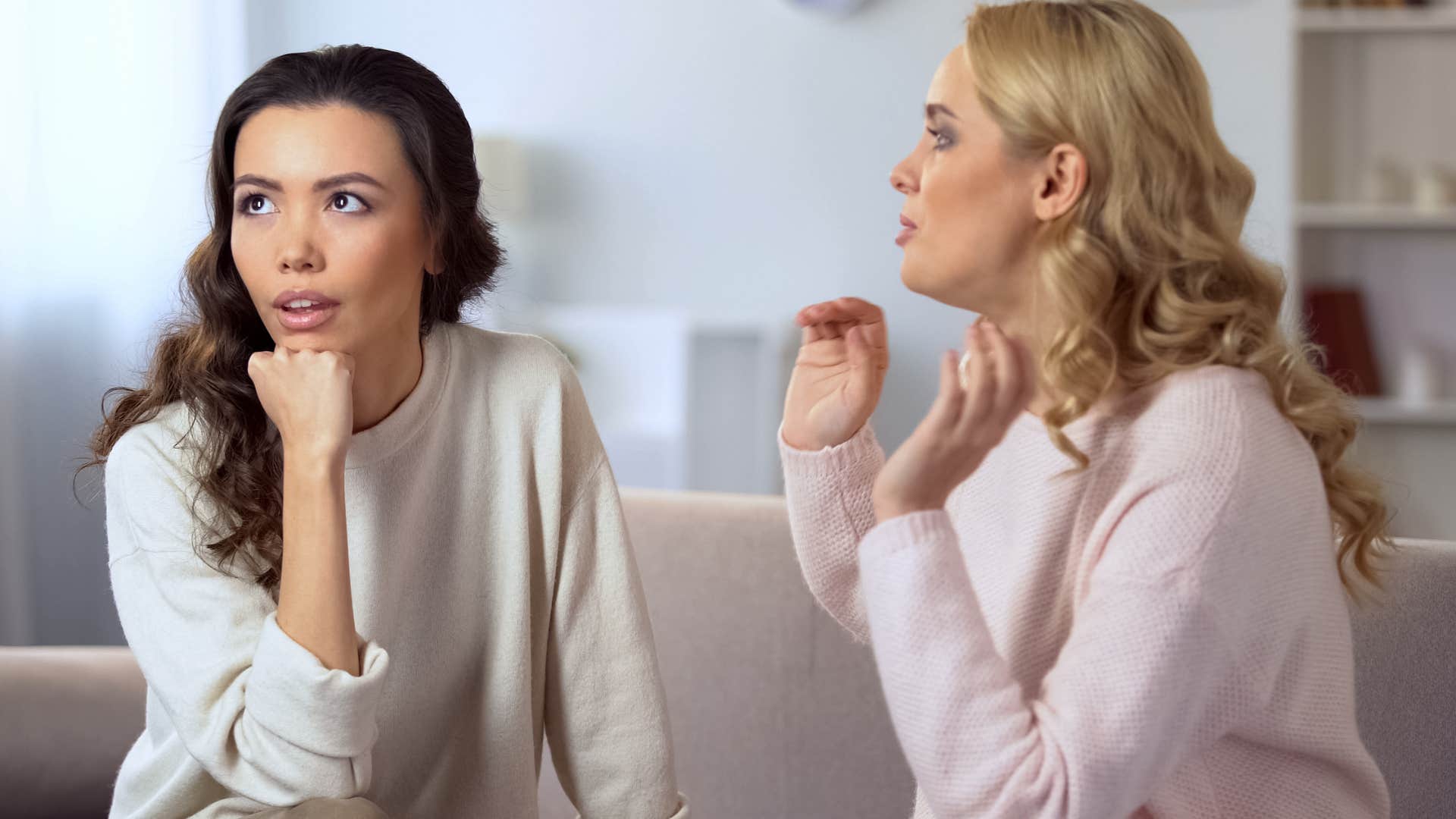 woman saying that's not my issue to her upset friend