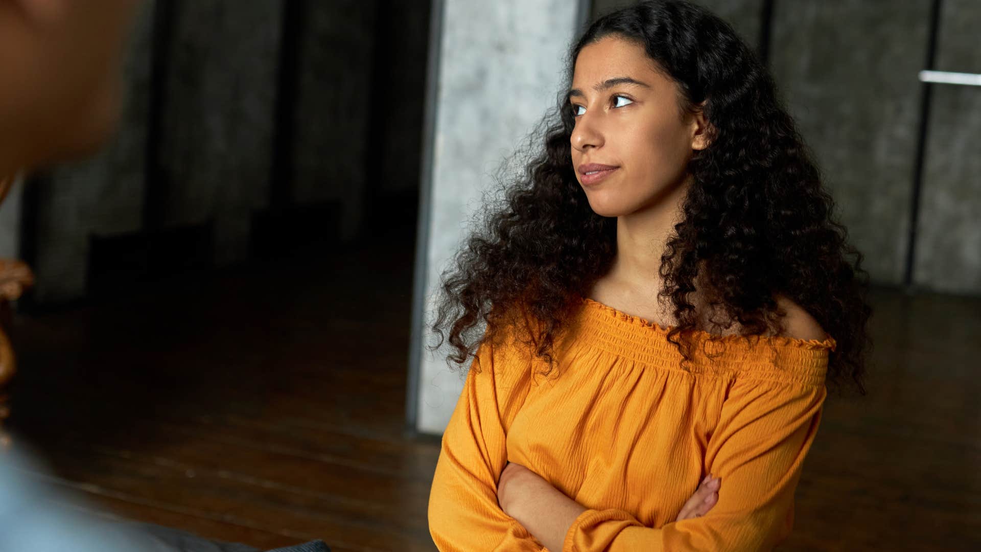 cold-hearted woman saying you'll get over it to her struggling friend