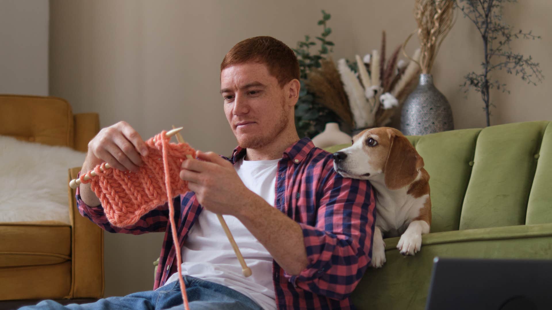 empathetic man knitting to express himself creatively