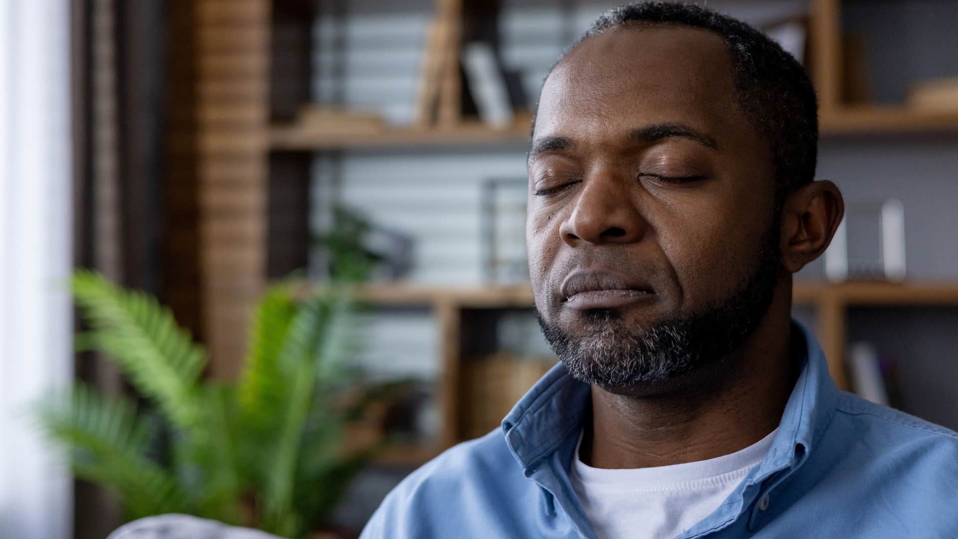 man regulating his own emotions at home