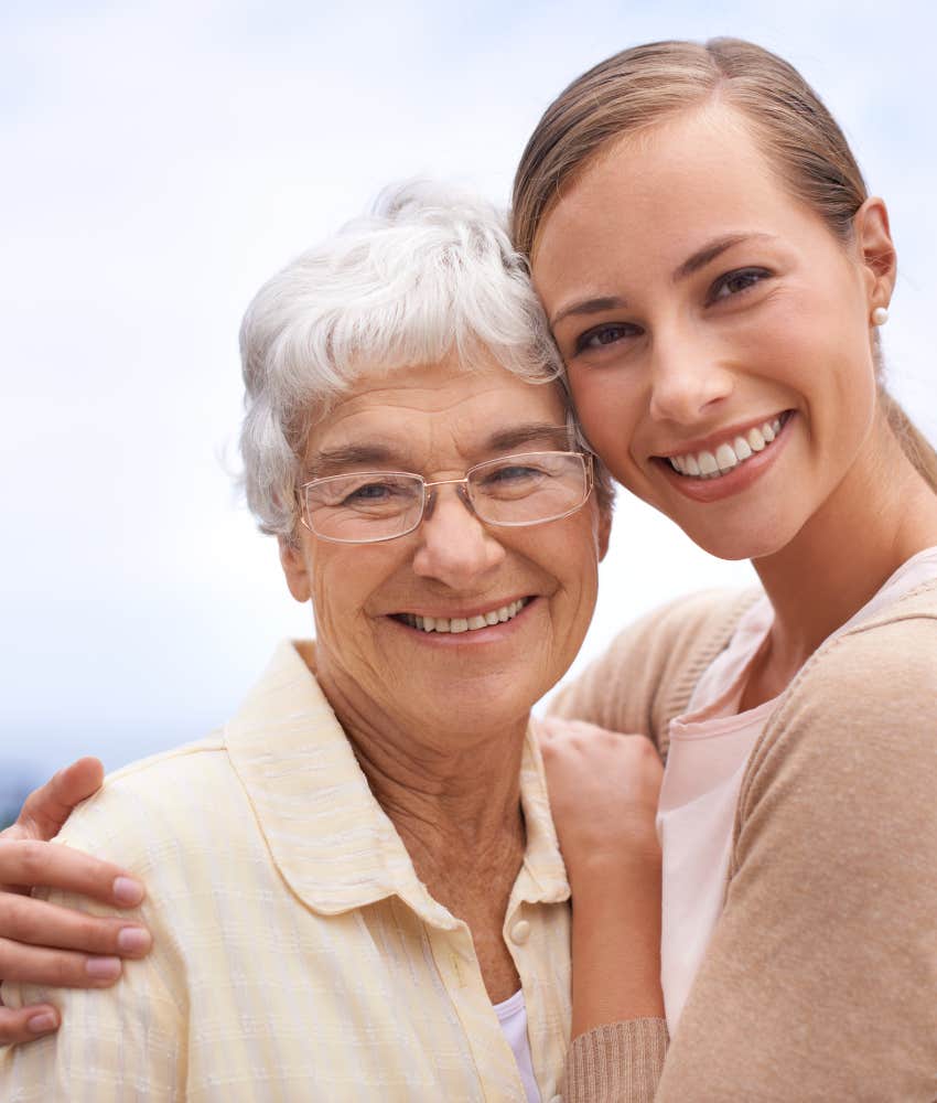 Elder mom and adult daughter embrace showing love and confidence