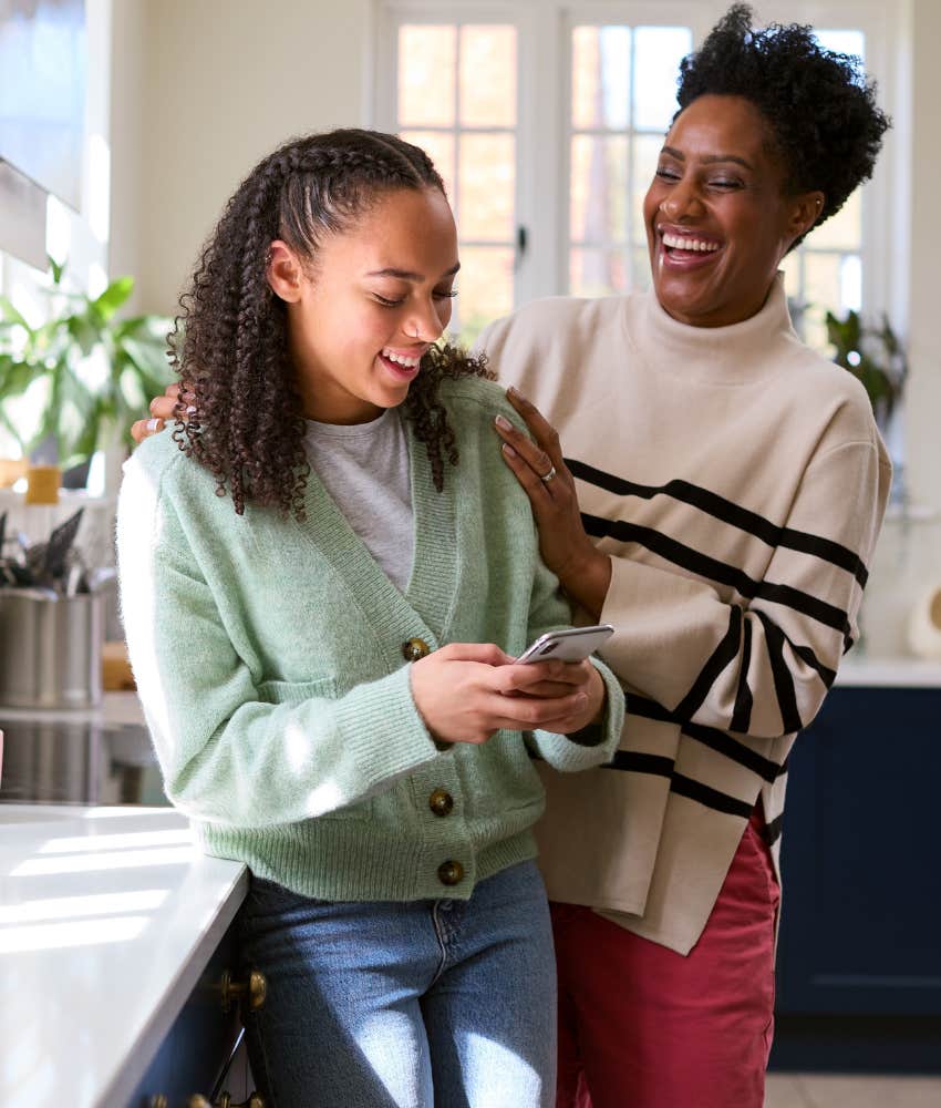 Happy mom models mindfulness for confident daughter