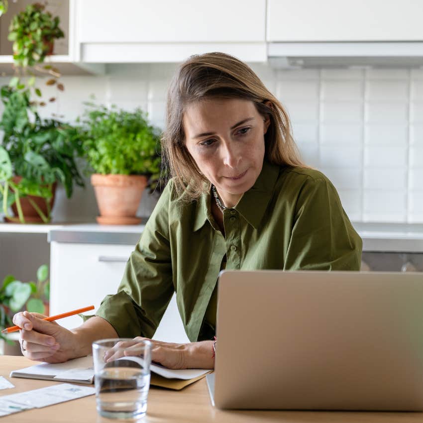 woman trying to budget after losing her job to AI