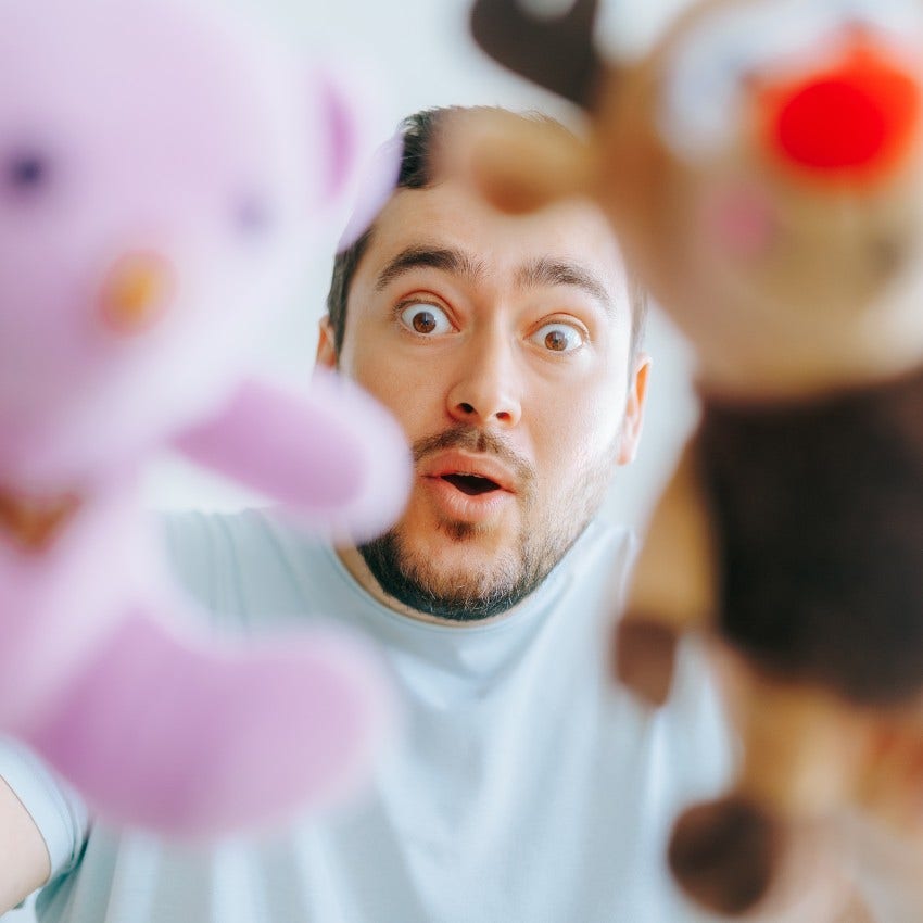 grown man with toys who is nostalgic for life that not longer exists