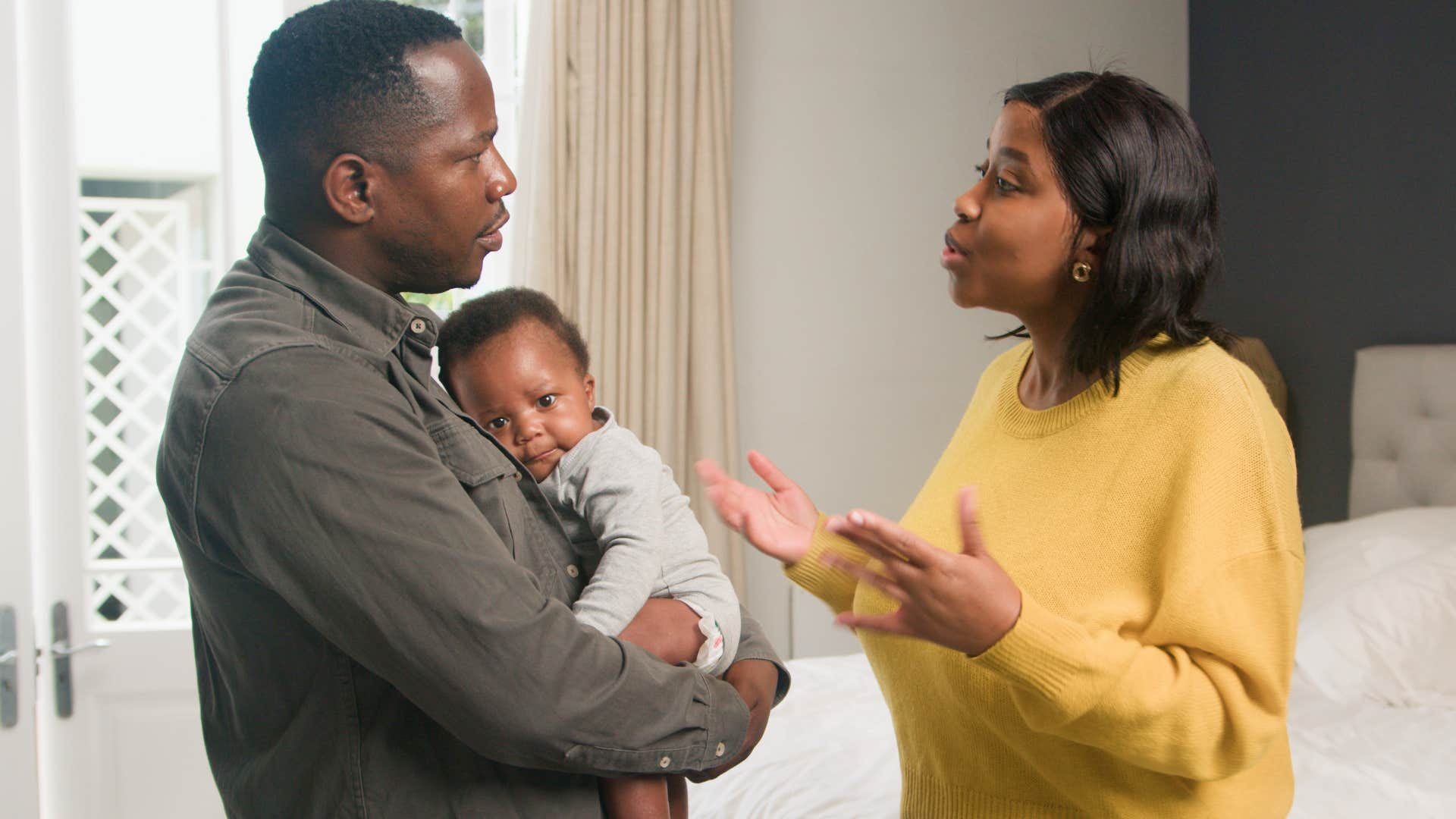 woman annoyed with husband who is making excuses