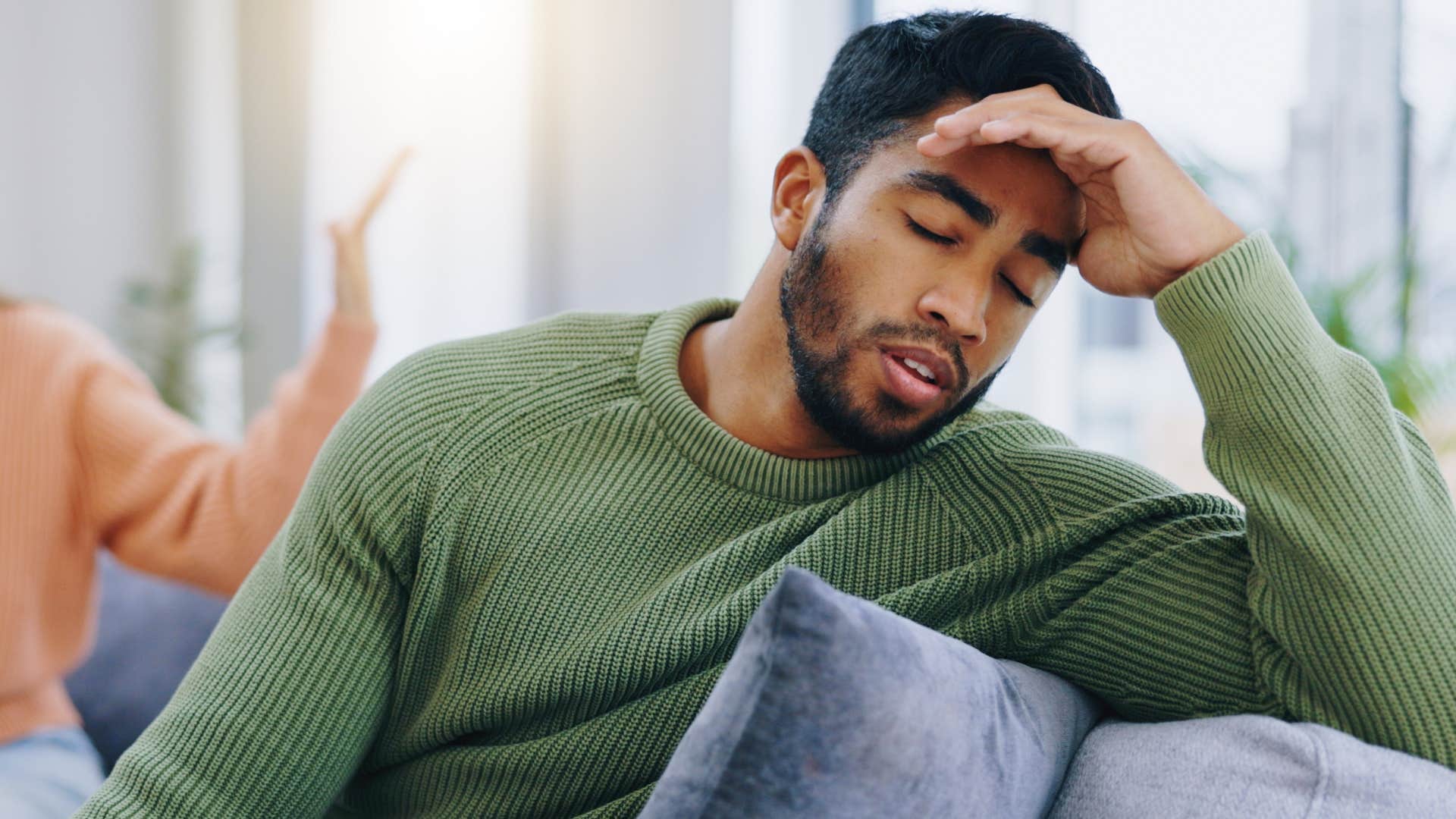 stressed man neglecting intimacy and physical touch with his wife
