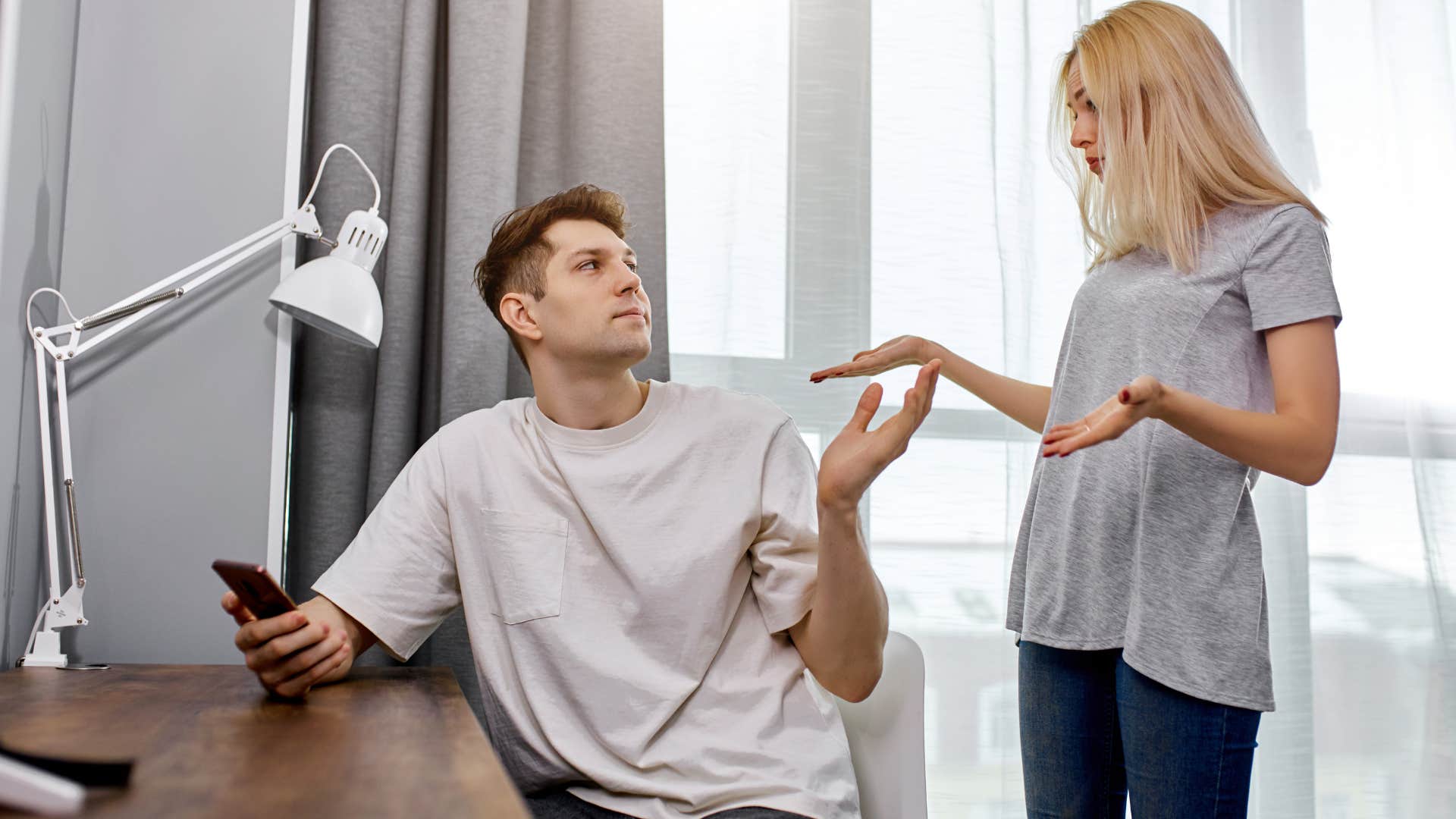 woman arguing with her husband about showing up late