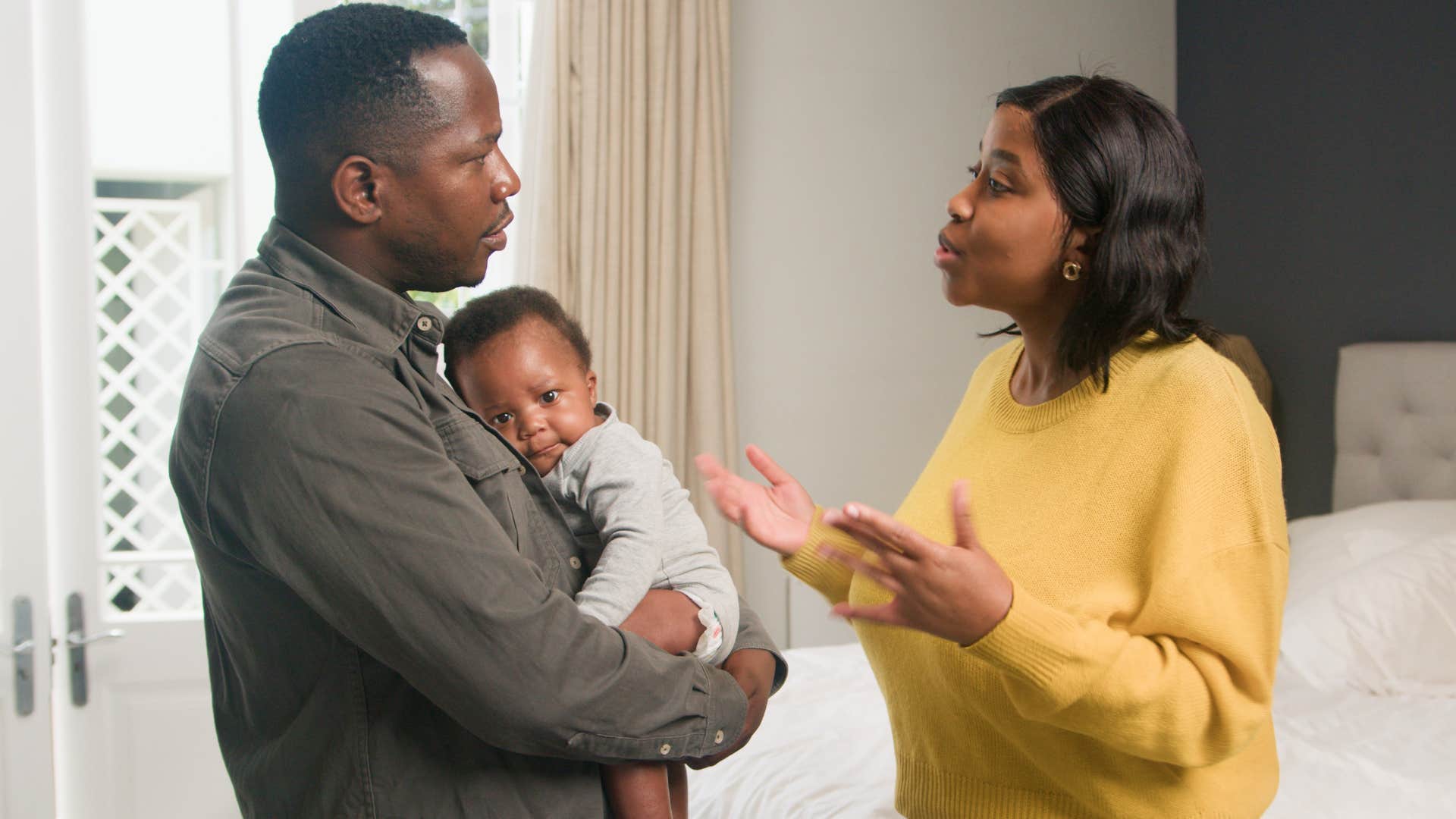 woman saying I knew this would happen to her husband holding a baby