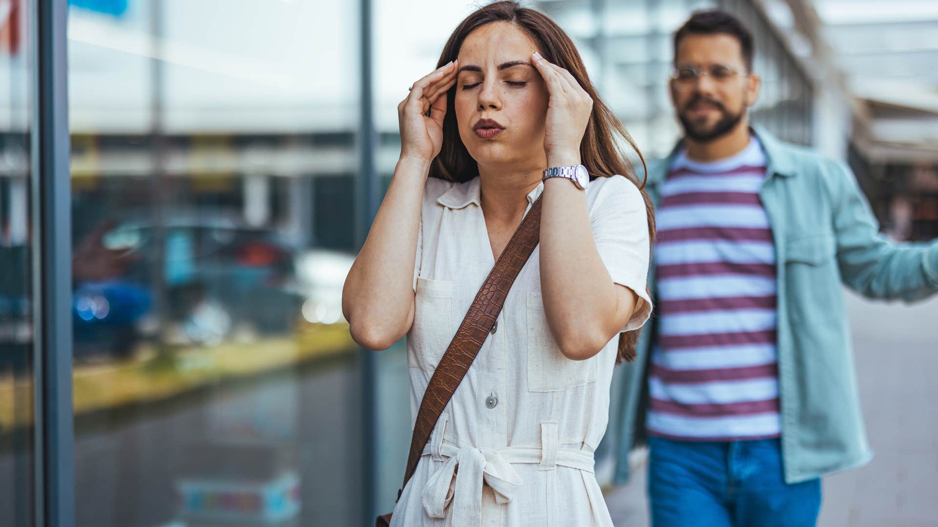 woman walking away from husband saying I shouldn't have to explain this to you