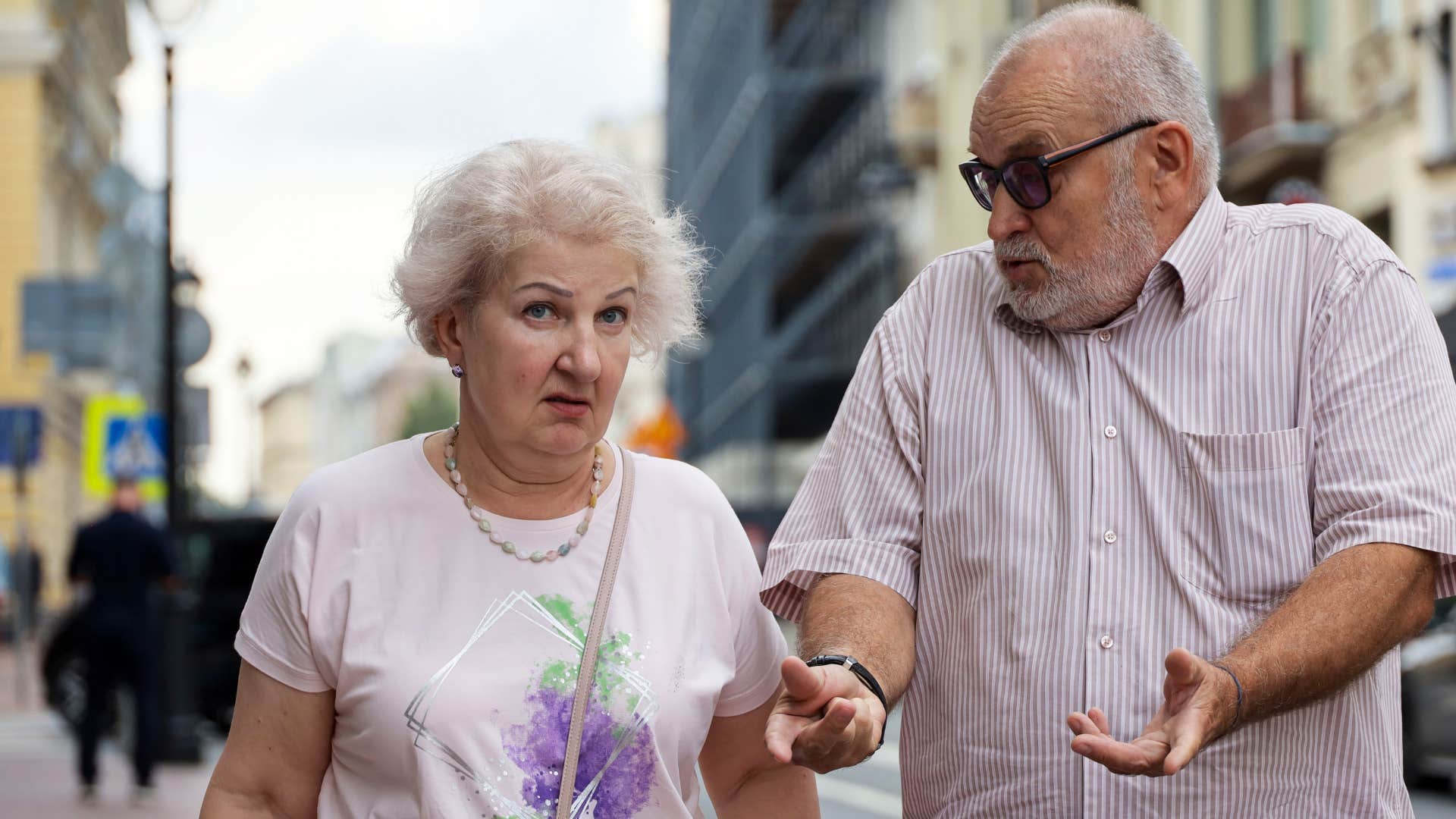 woman ignoring husband and saying that's not my problem