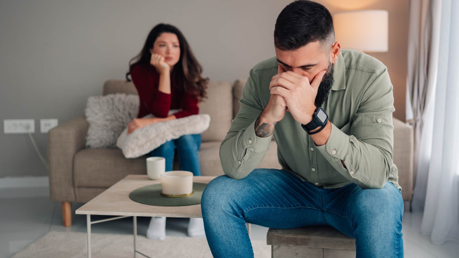 Wife saying "you're so sensitive" to her upset husband.