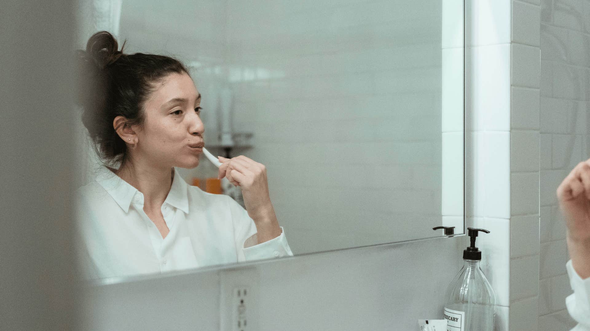 woman making a man feel something by spending time on their oral hygiene