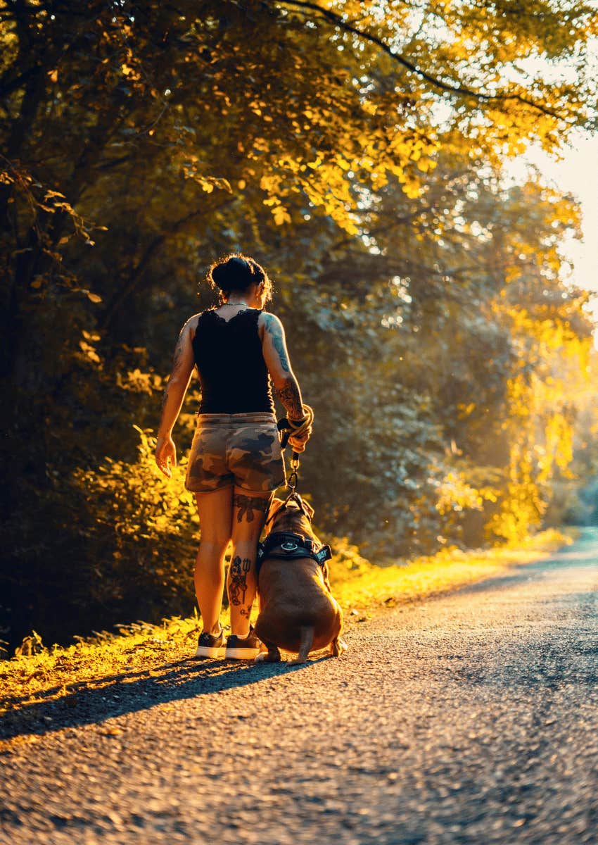 woman on morning walk with dog