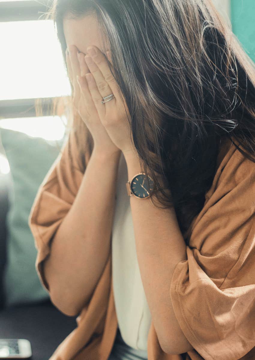 upset woman realizing abusers' actions and words don't match