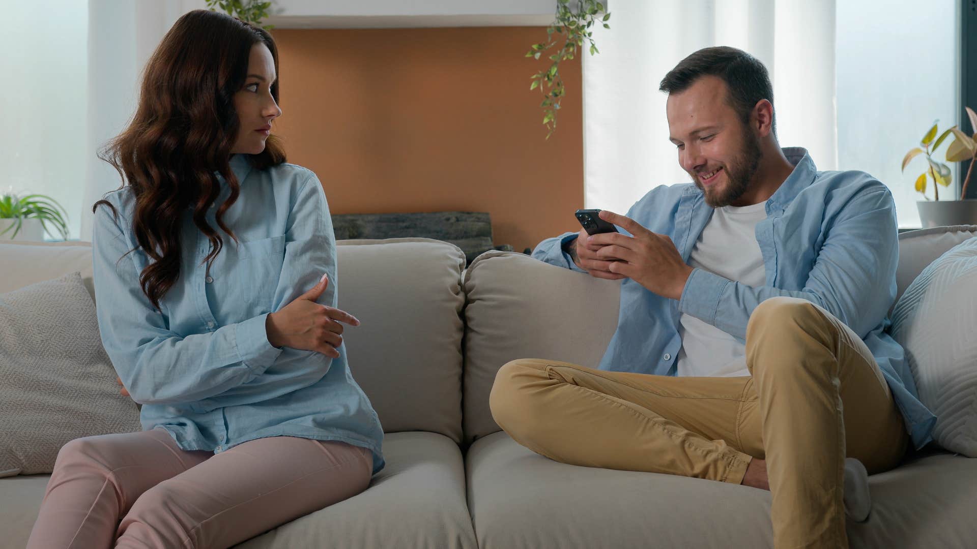 wife sitting with her husband who makes jokes at her expense