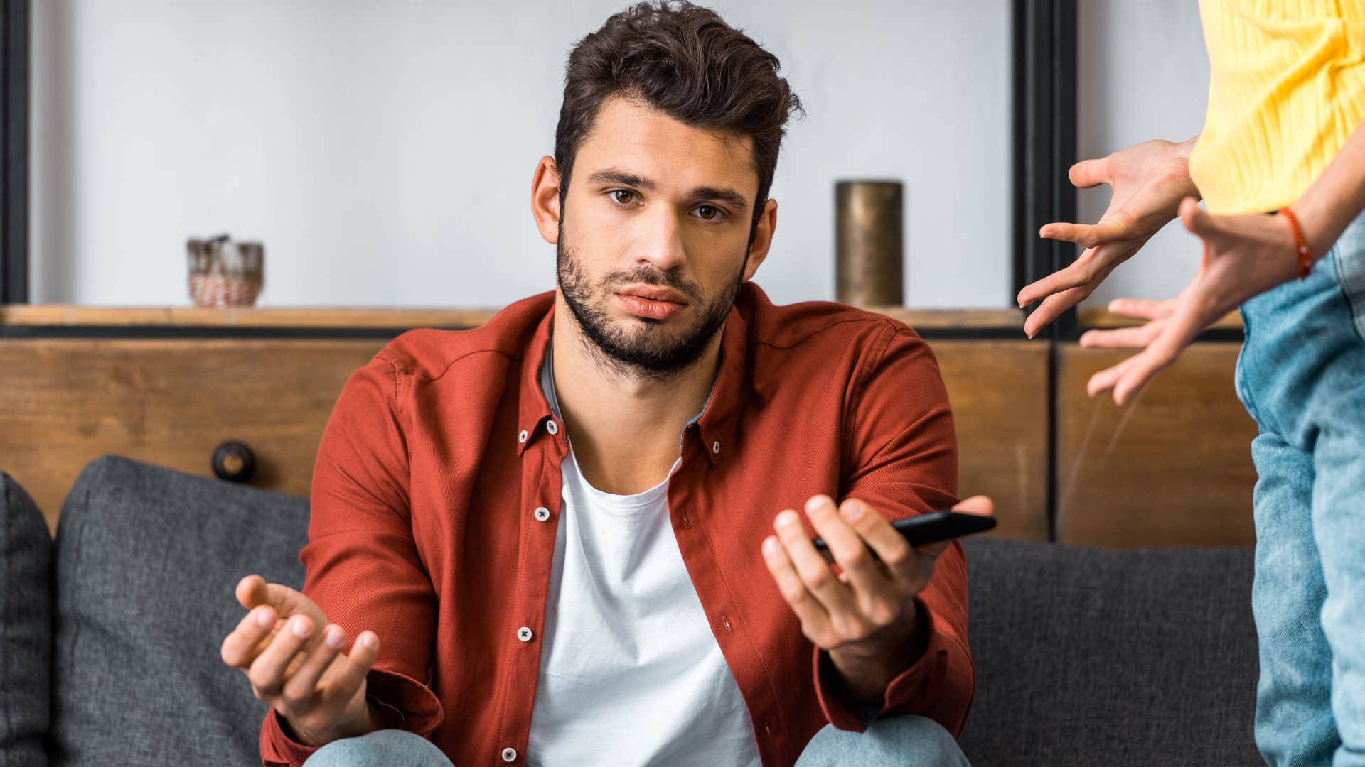 rude man who refuses to own up to his mistakes shrugging off his wife