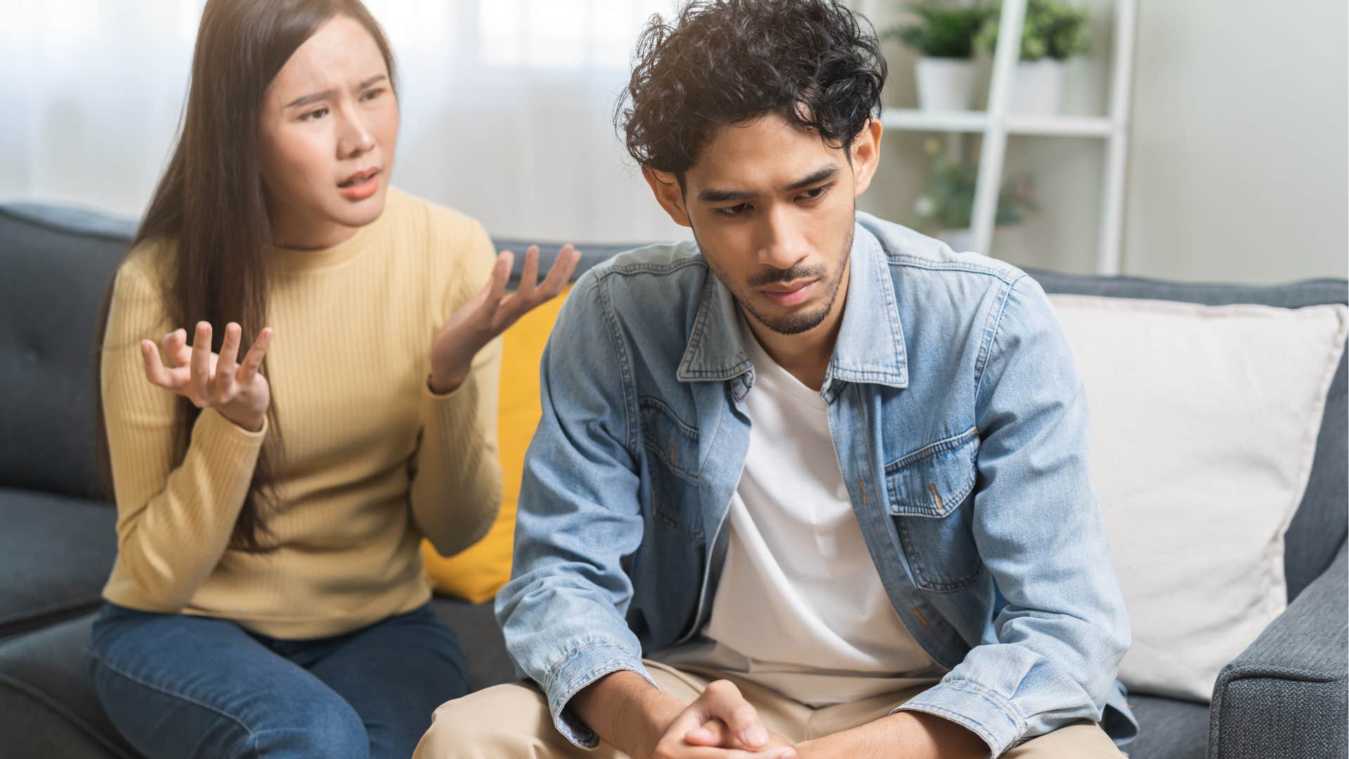 woman sitting by husband who invalidates and dismisses her feelings