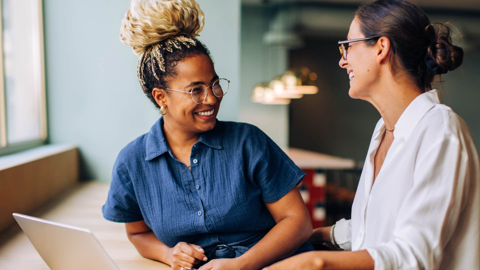 Woman who is empathetic and aware talking at work.