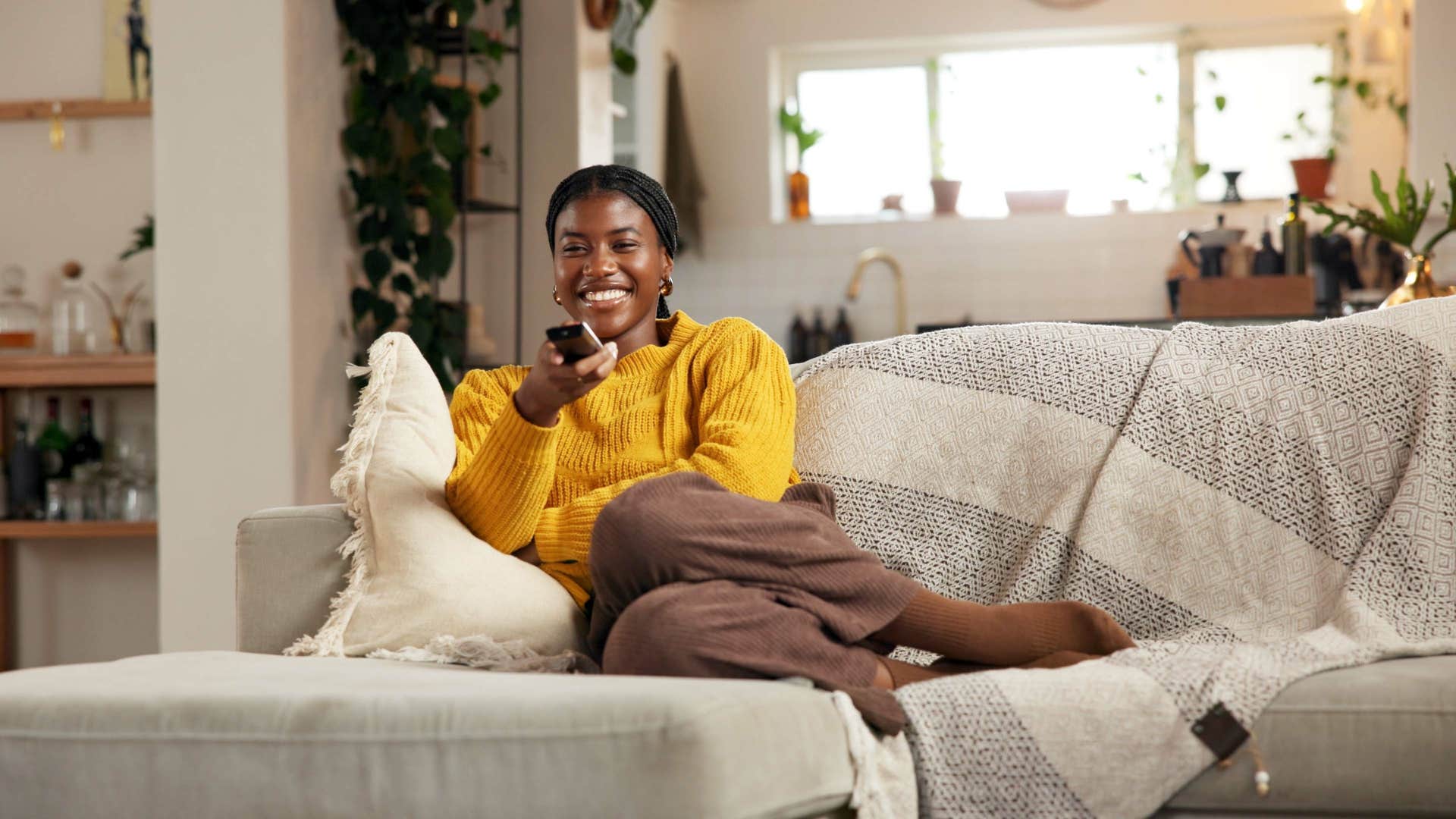 woman binge-watches shows to avoid being alone with her thoughts