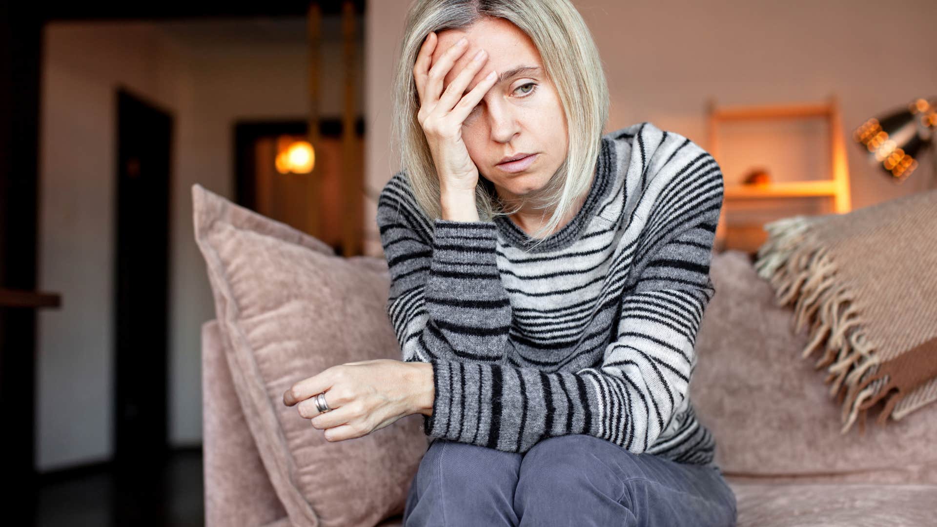 upset woman suppresses her emotions instead of expressing them