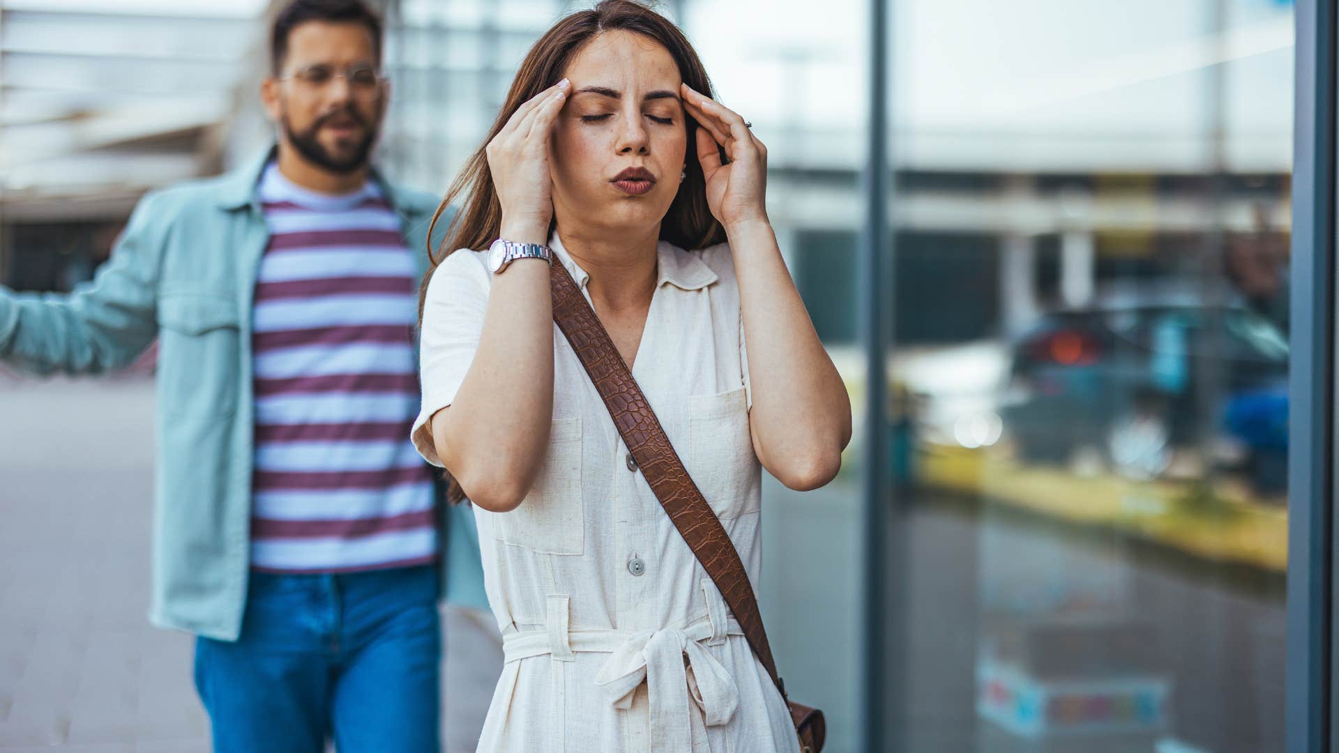 frustrated woman saying I'll just do it myself walking away from man