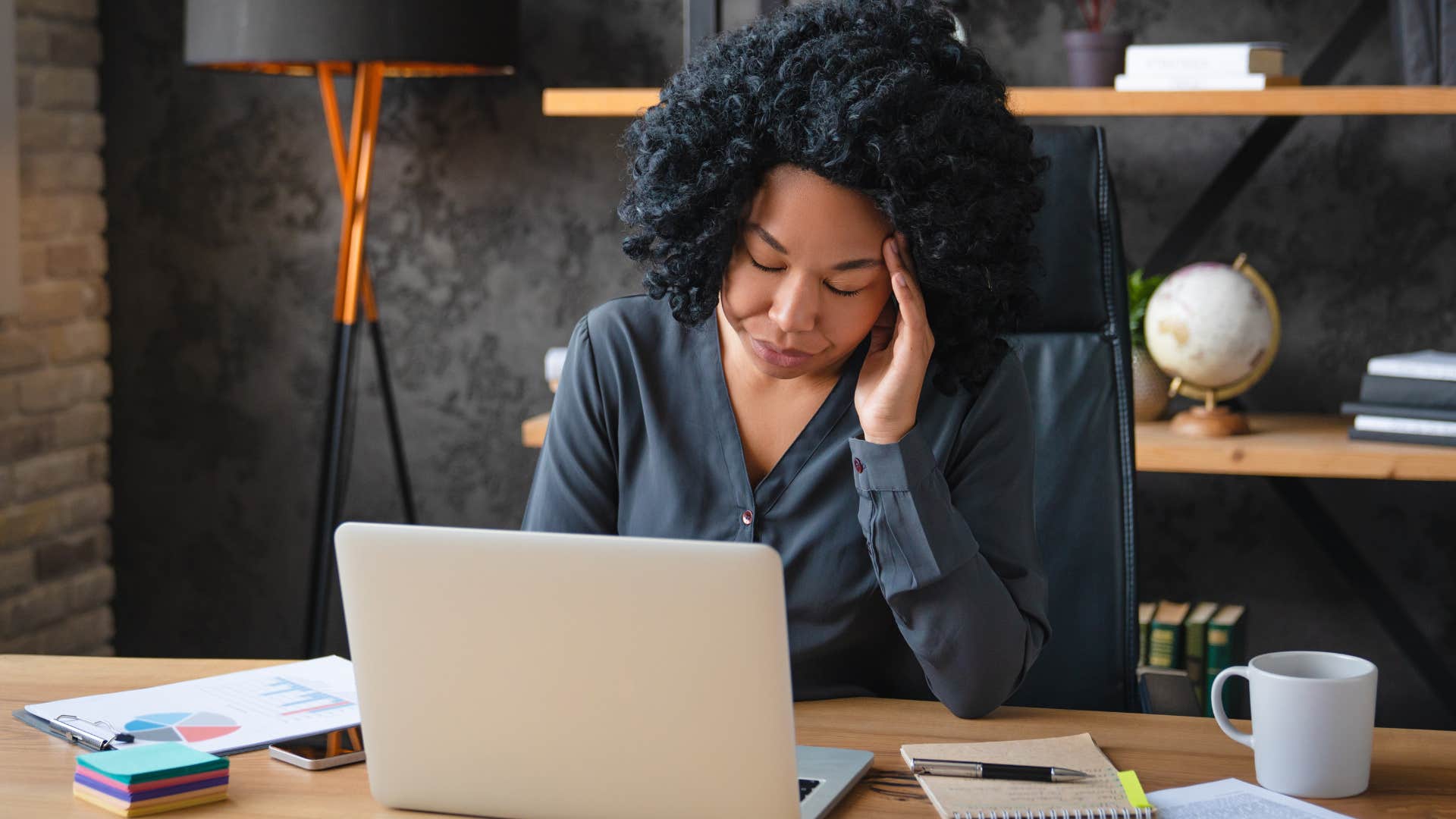 woman who doesn't trust anyone balancing all her tasks alone at work
