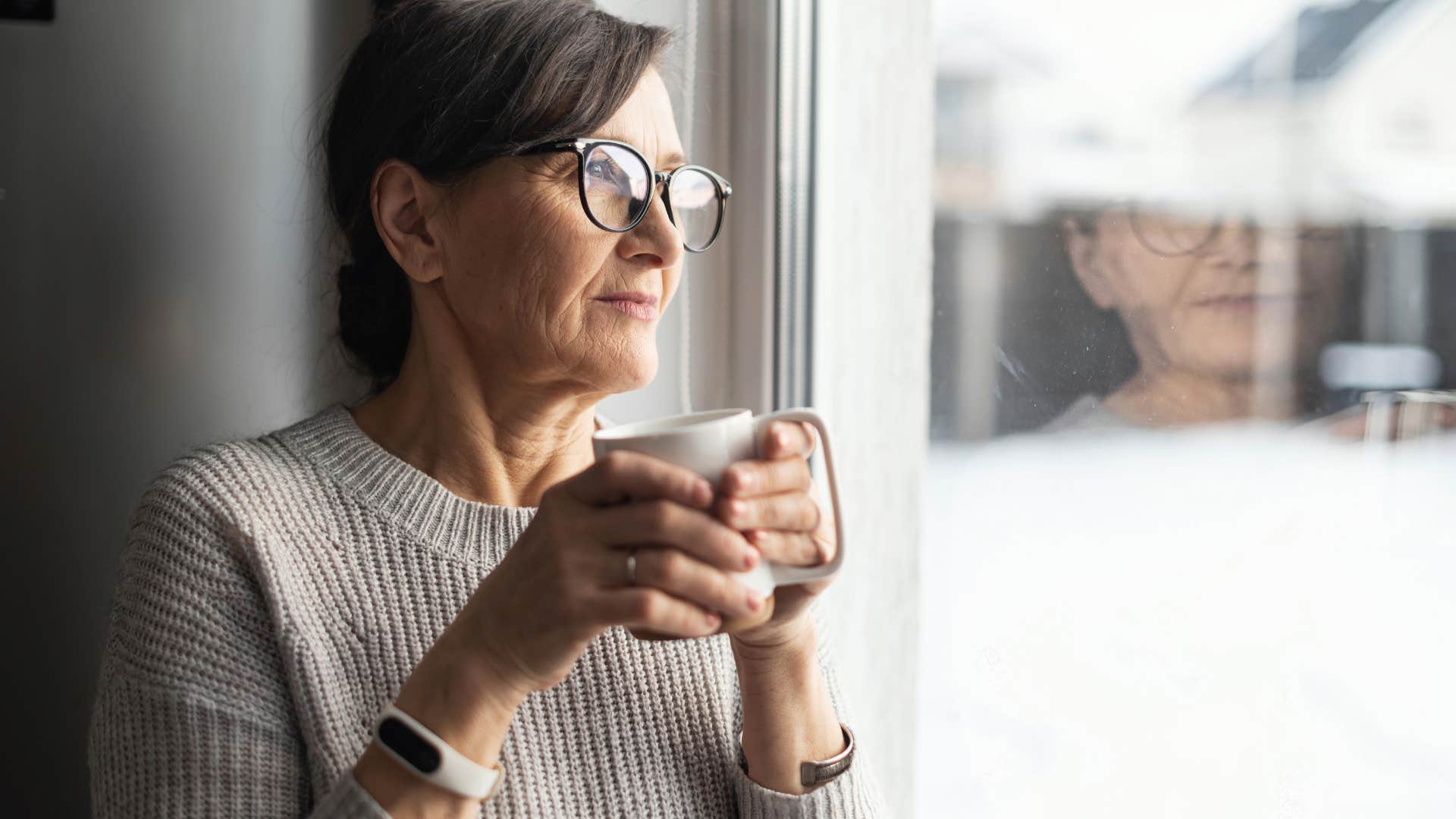 older woman who forms her own routines drinking coffee