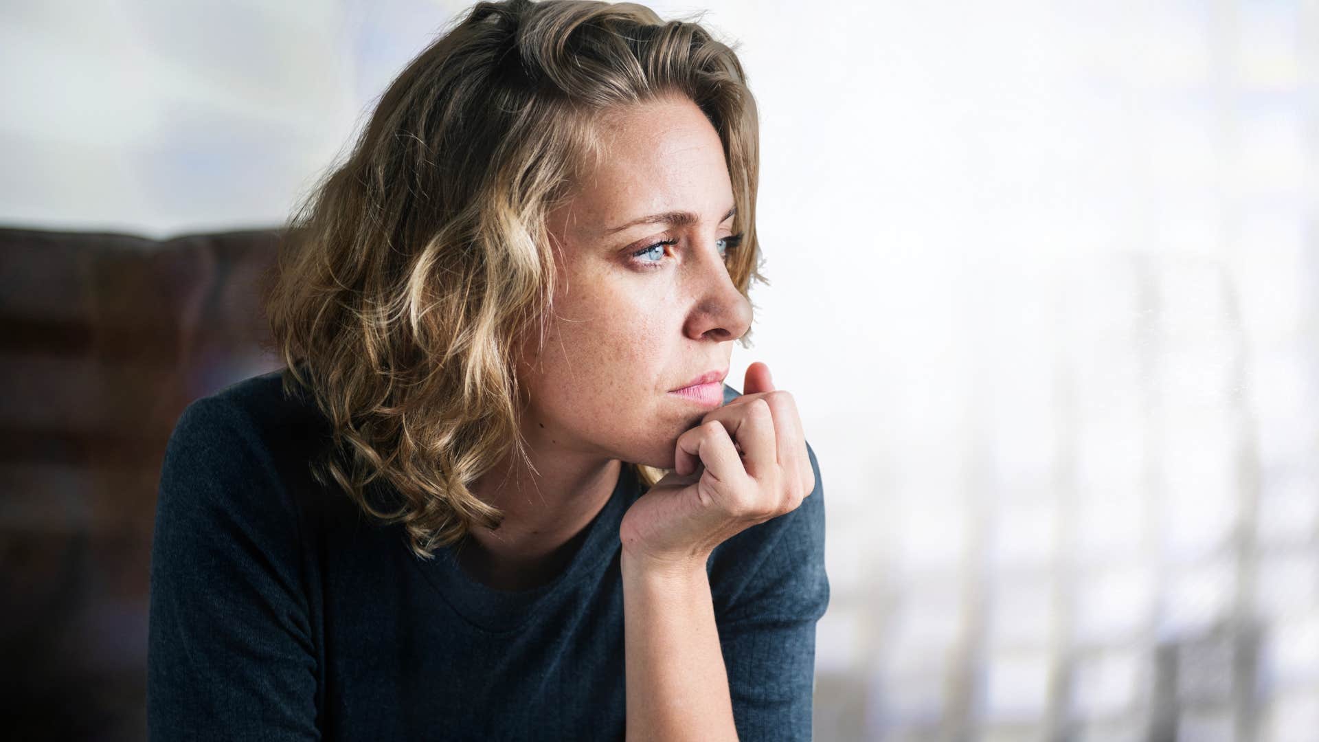 sad detached woman getting through adversity with avoidance