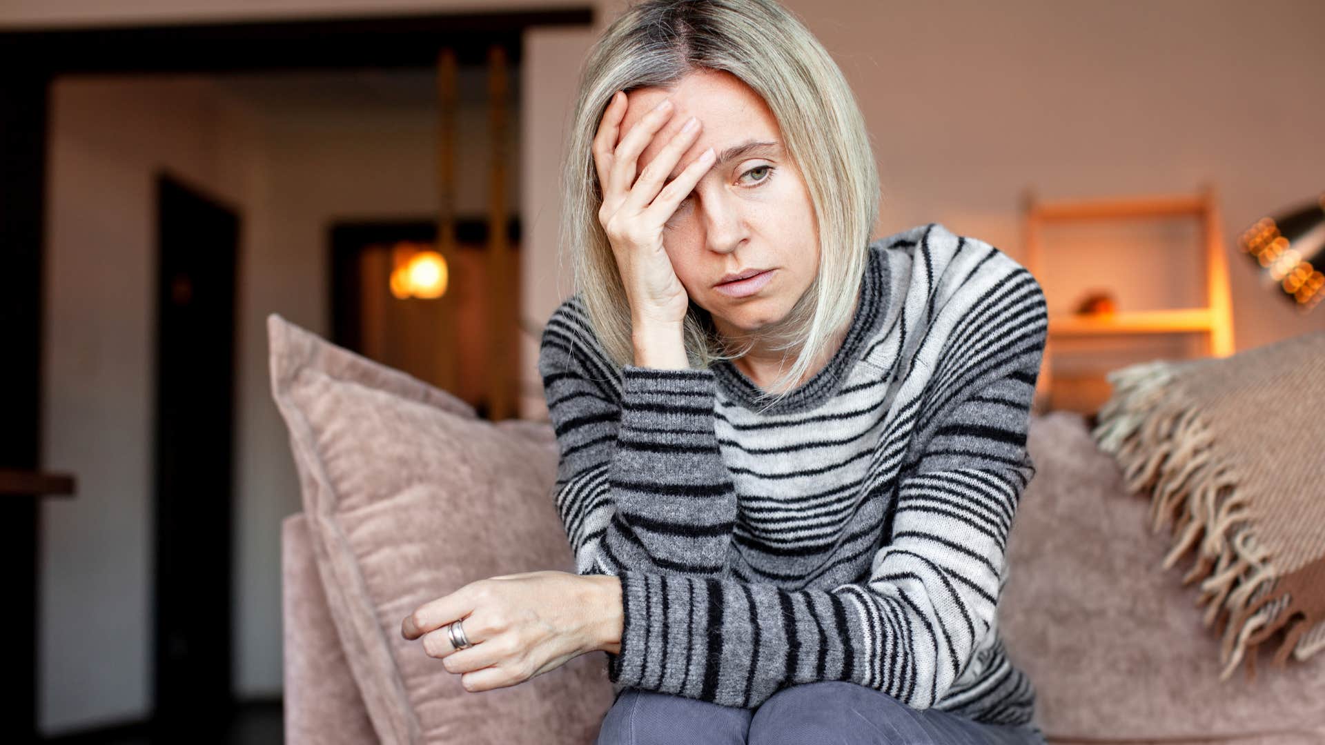 sad woman who manages her emotions alone at home