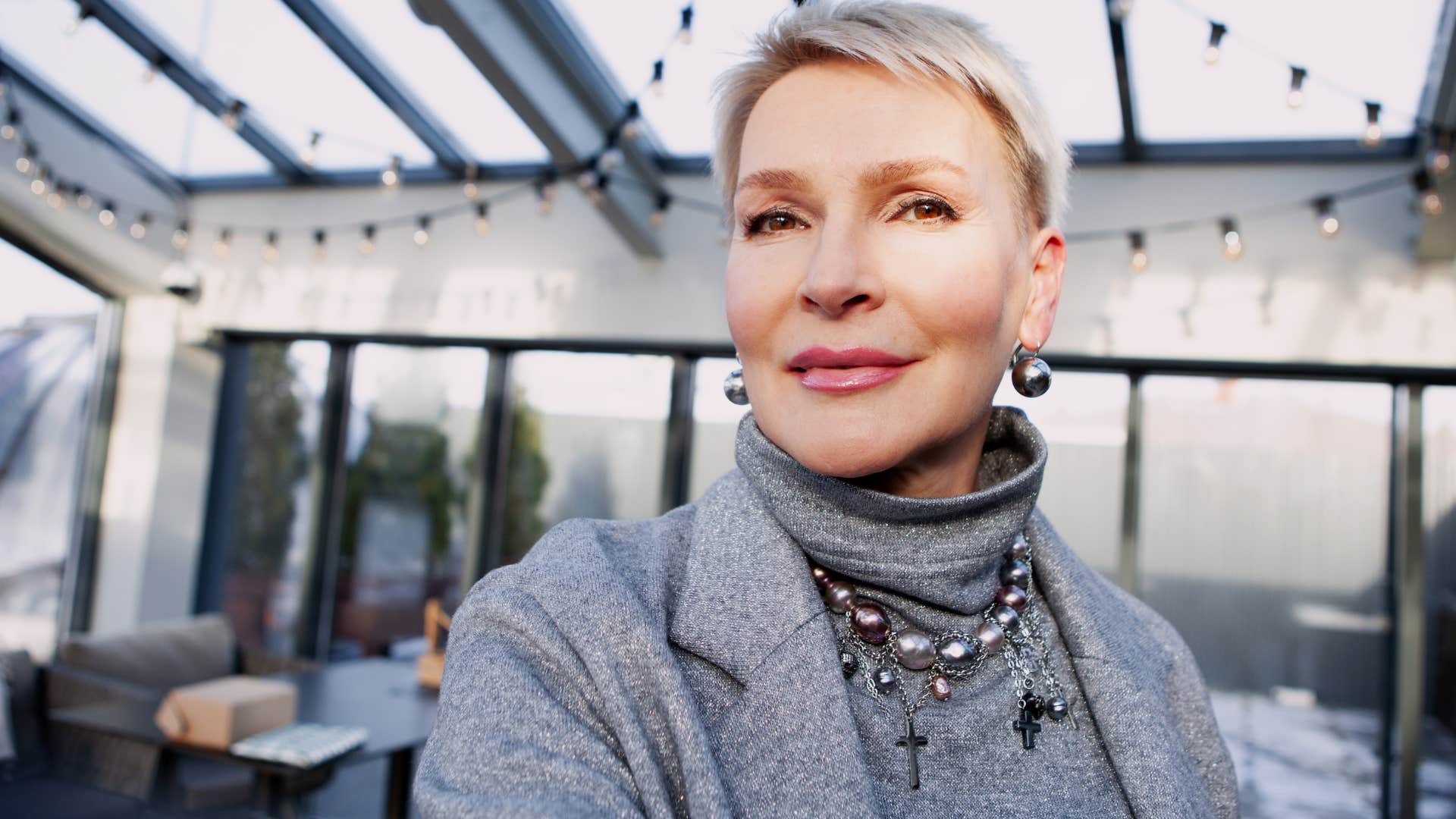 Adaptable woman with short hair smiling in an office