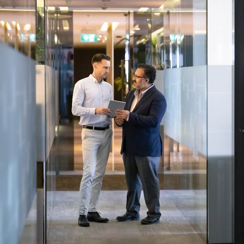 worker who calls unlimited pto a scam talking to his boss about taking time off