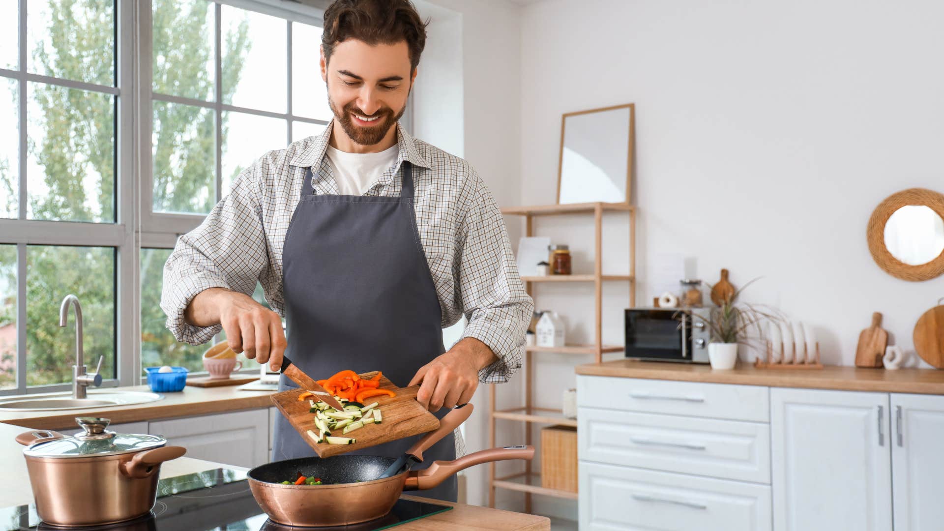 man cooking in kitchen