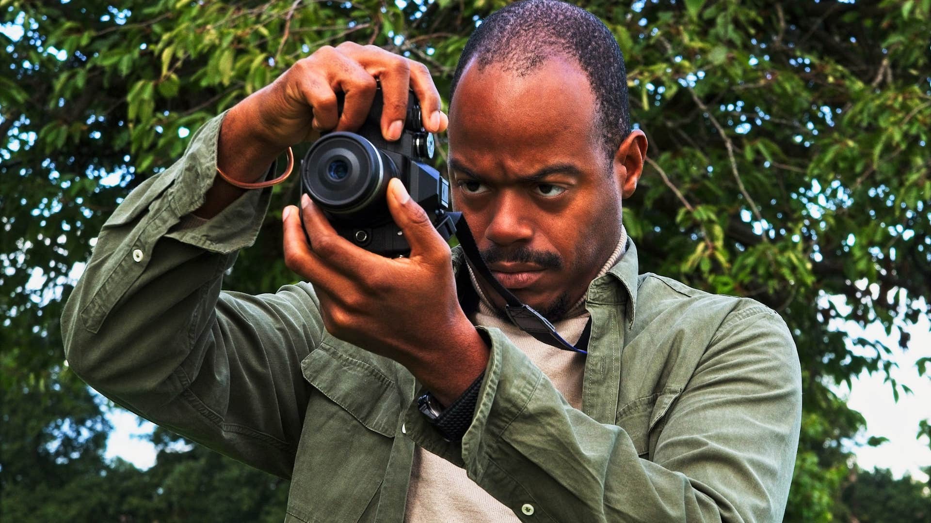 man taking photo on camera