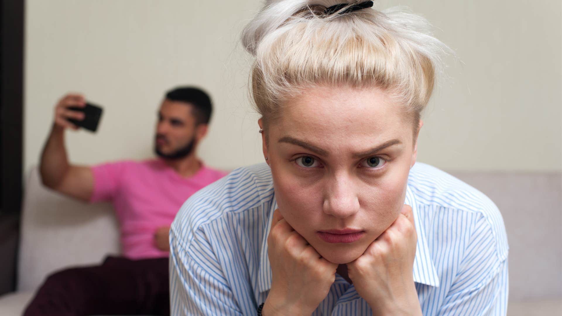 Self-loathing woman with distracted man showing unlikable trait