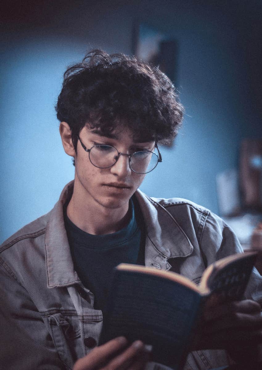 young man reading a book