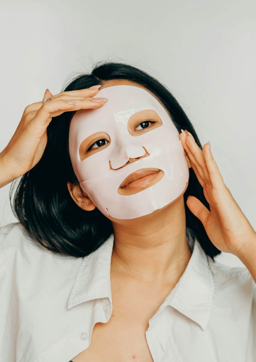 young woman adjusting face mask