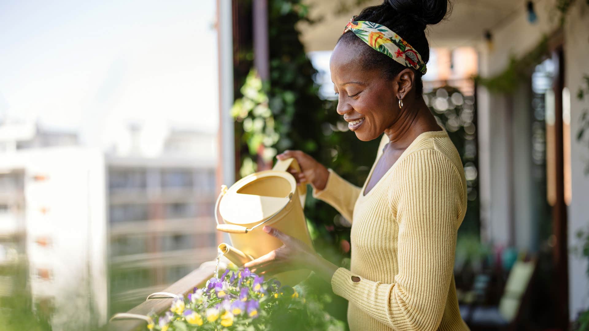 happy person appreciates watering plants