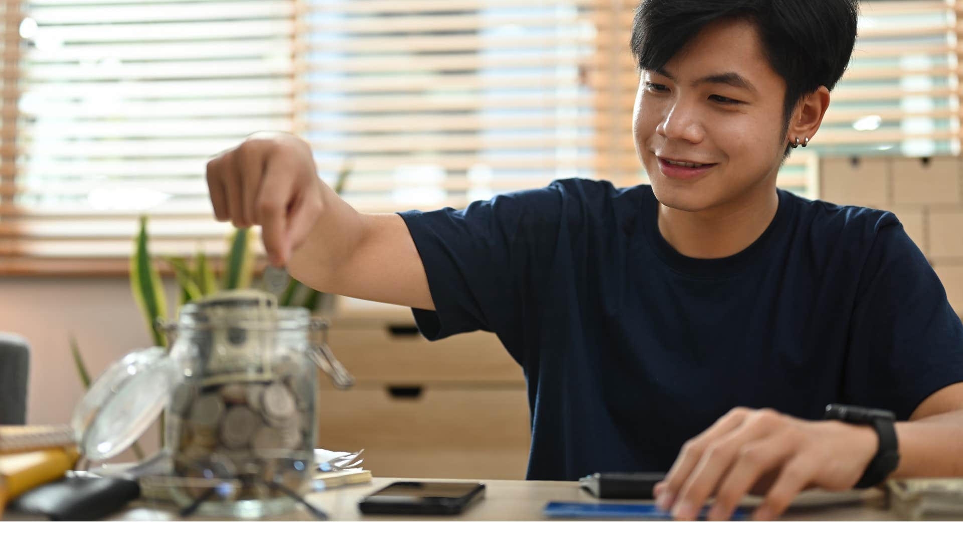 Happy person saves money to live within their means