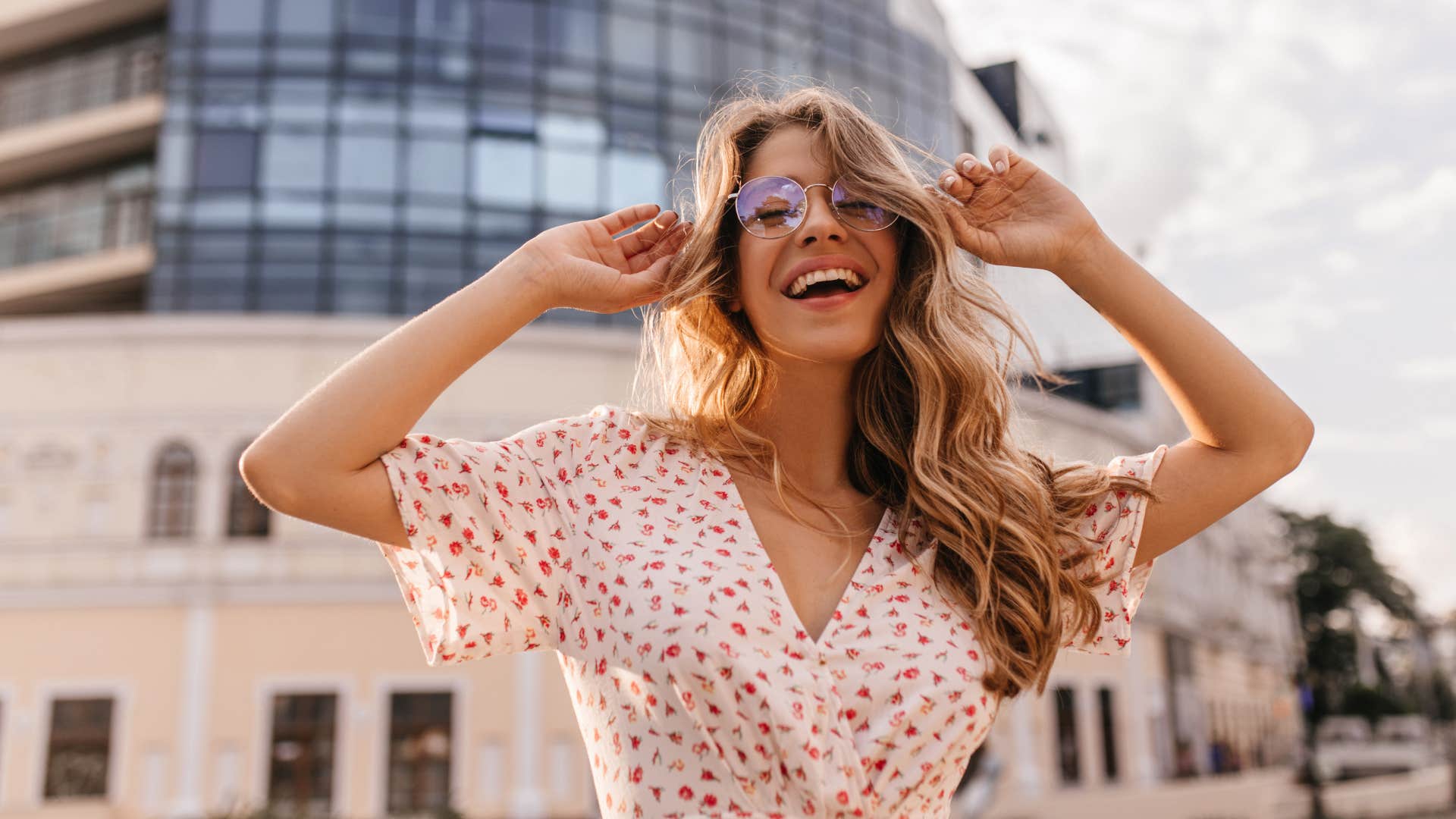 excited person in city showing habit of choosing optimism