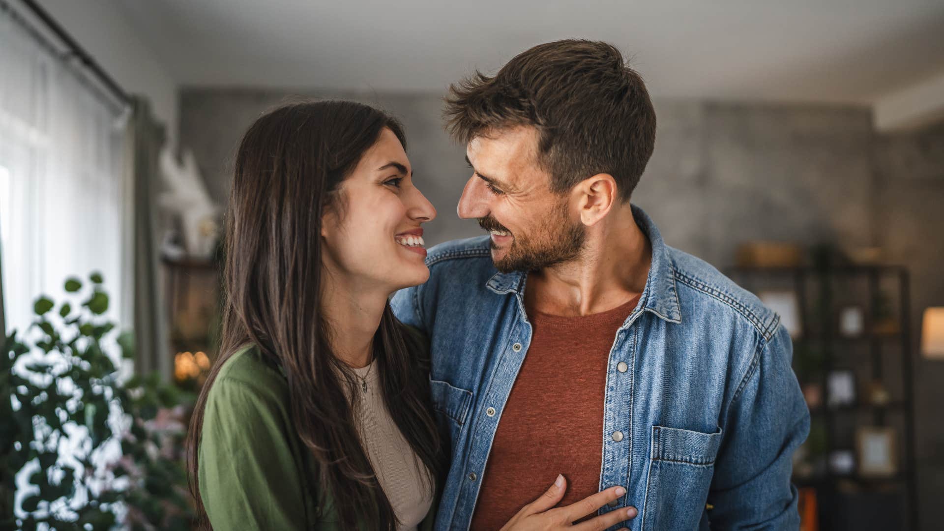 couple smiling at each other with husband telling wife you mean everything to me